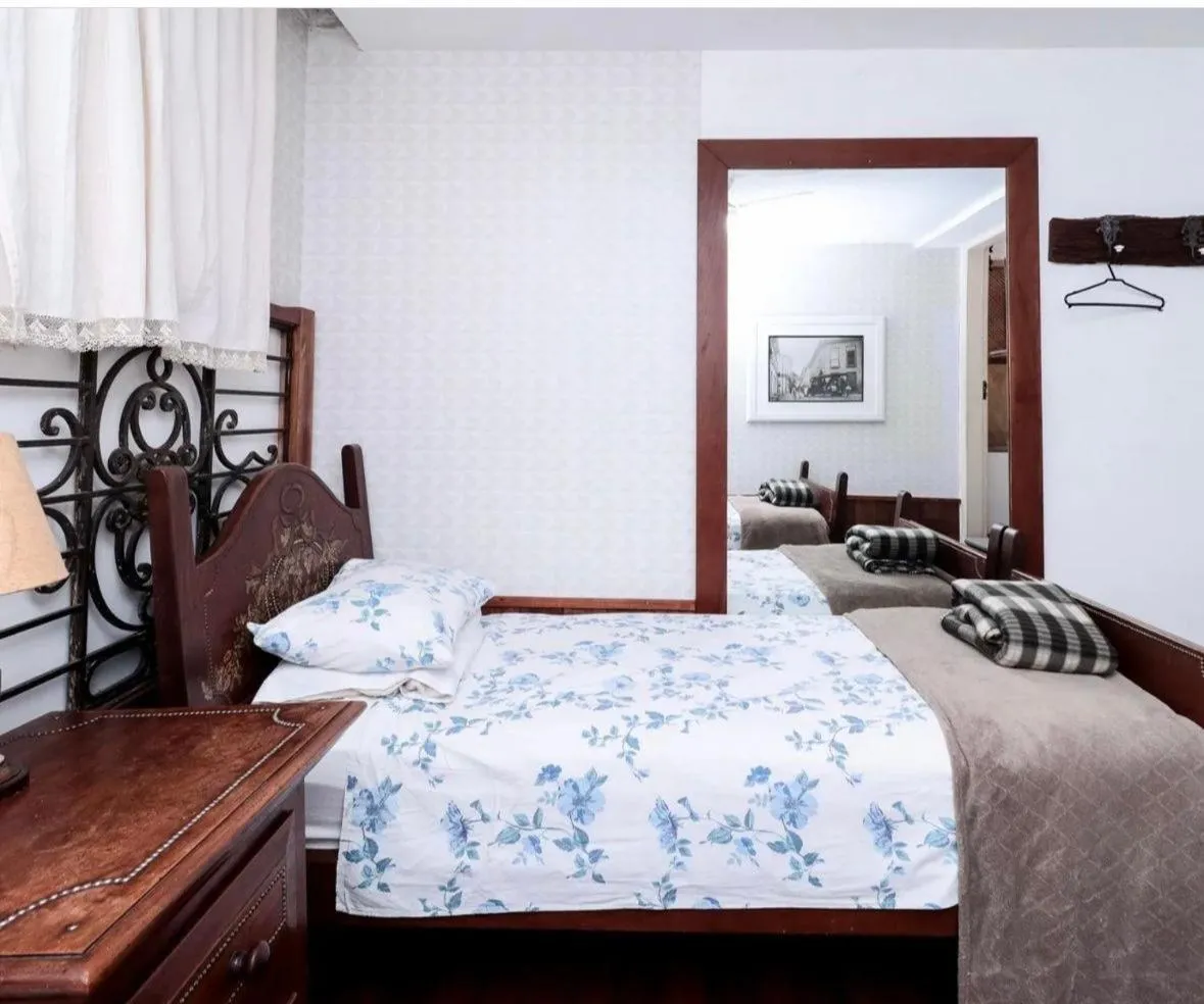 Bed in Pousada Casarão 53
