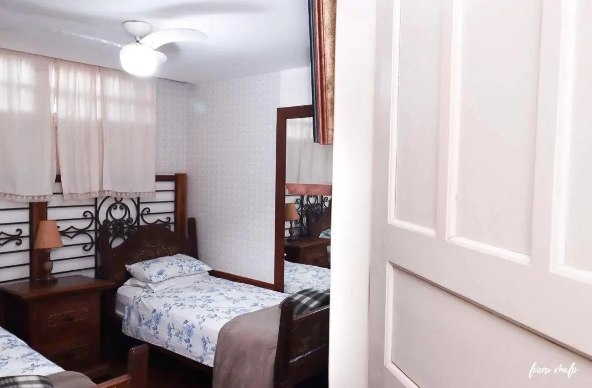 Bed in Pousada Casarão 53