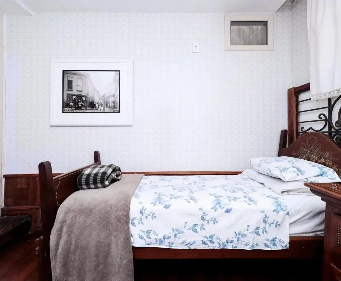 Bed in Pousada Casarão 53