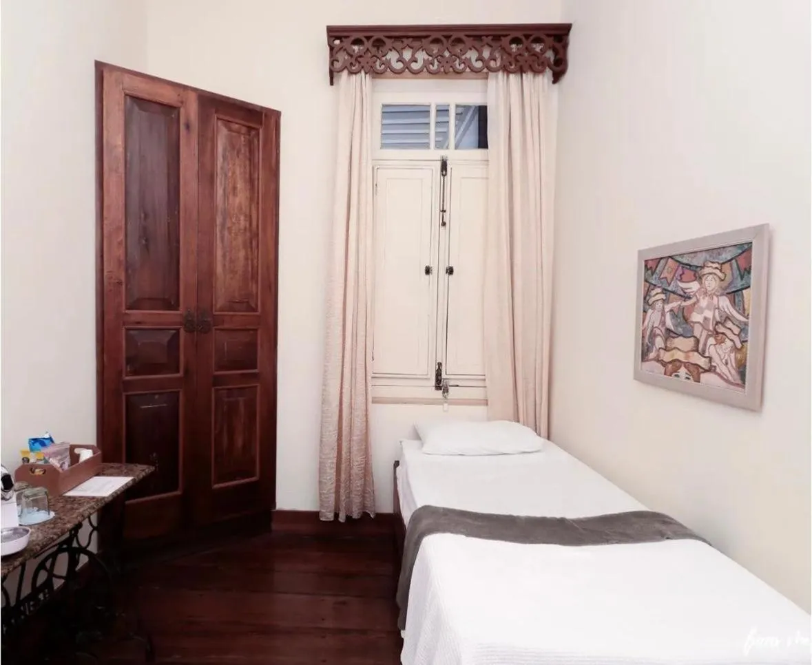 Bed in Pousada Casarão 53