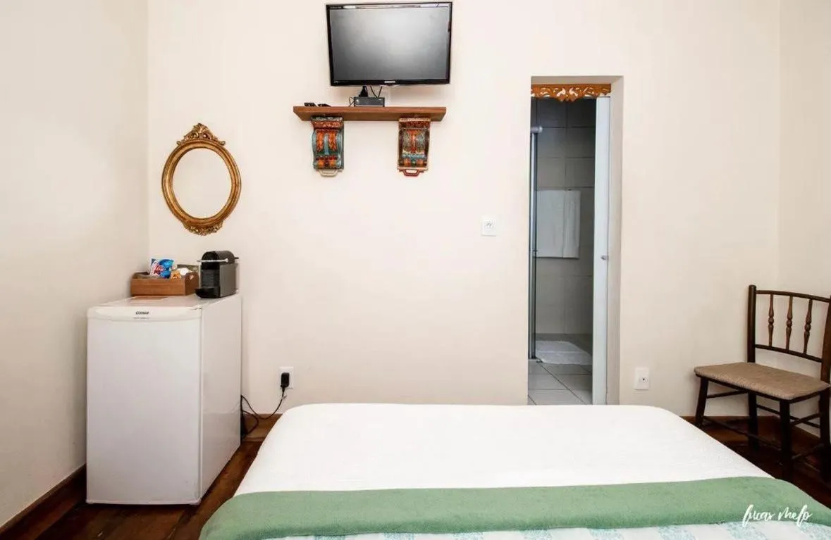 Bed in Pousada Casarão 53