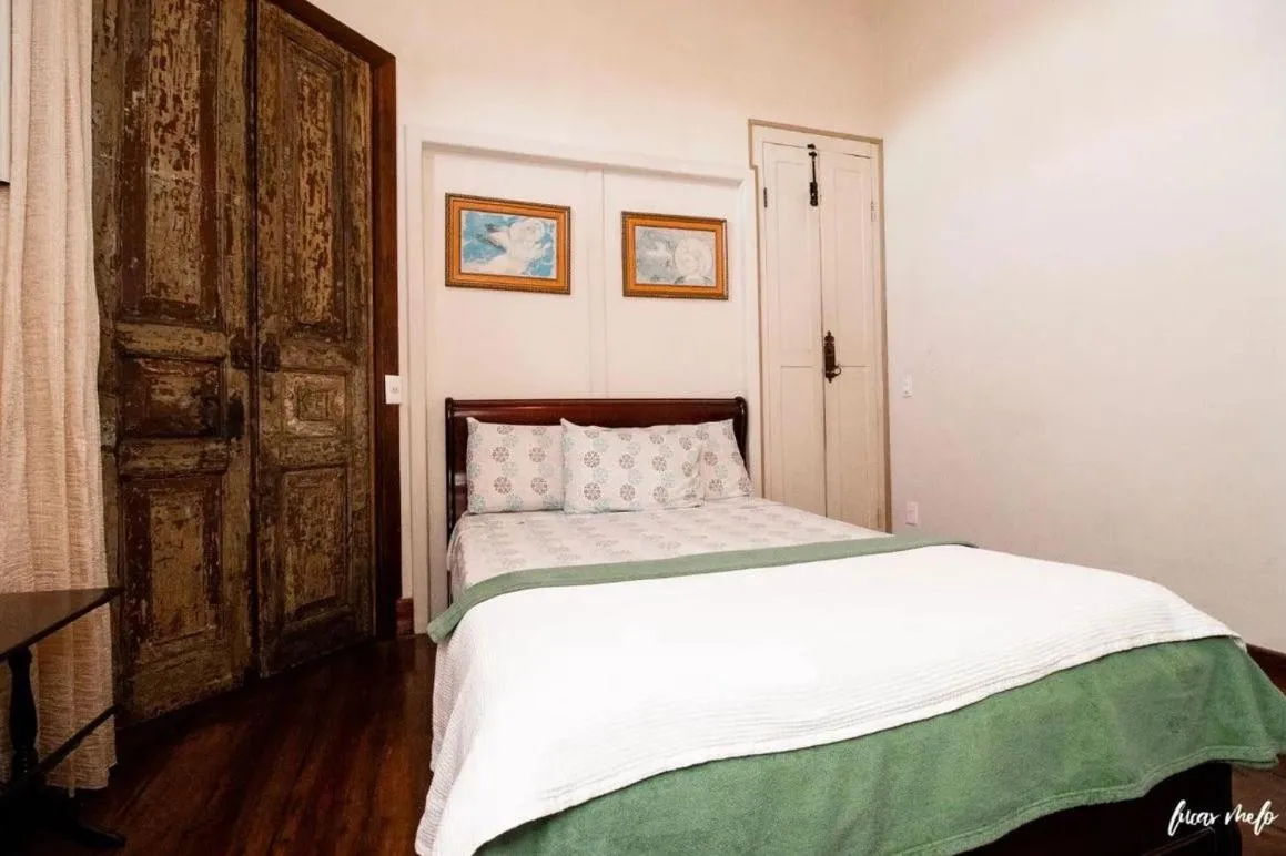 Bed in Pousada Casarão 53