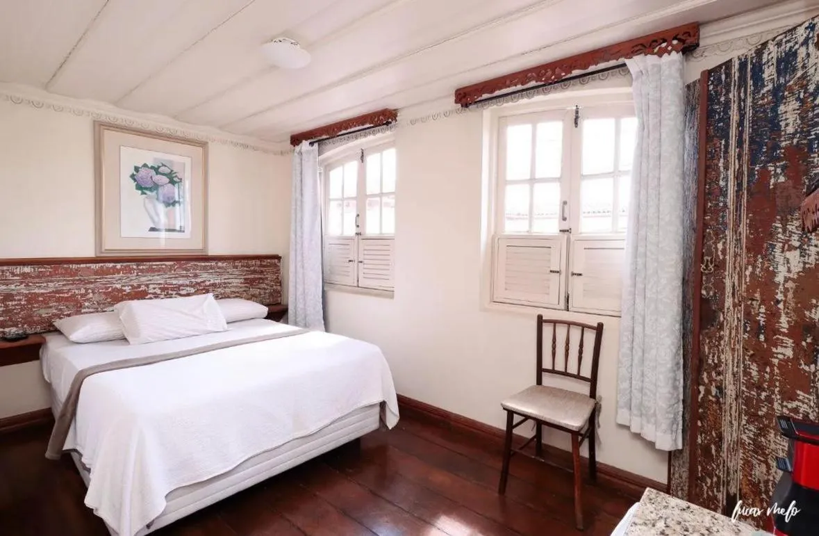 Bed in Pousada Casarão 53