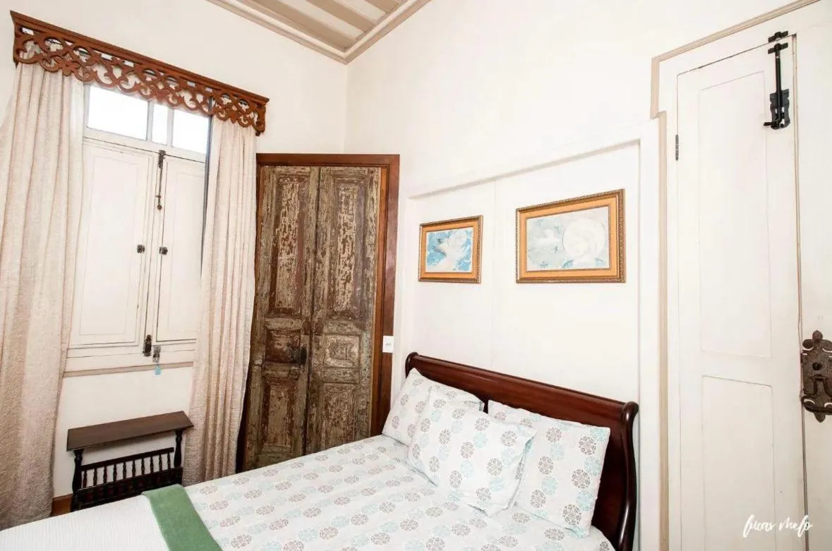 Bed in Pousada Casarão 53