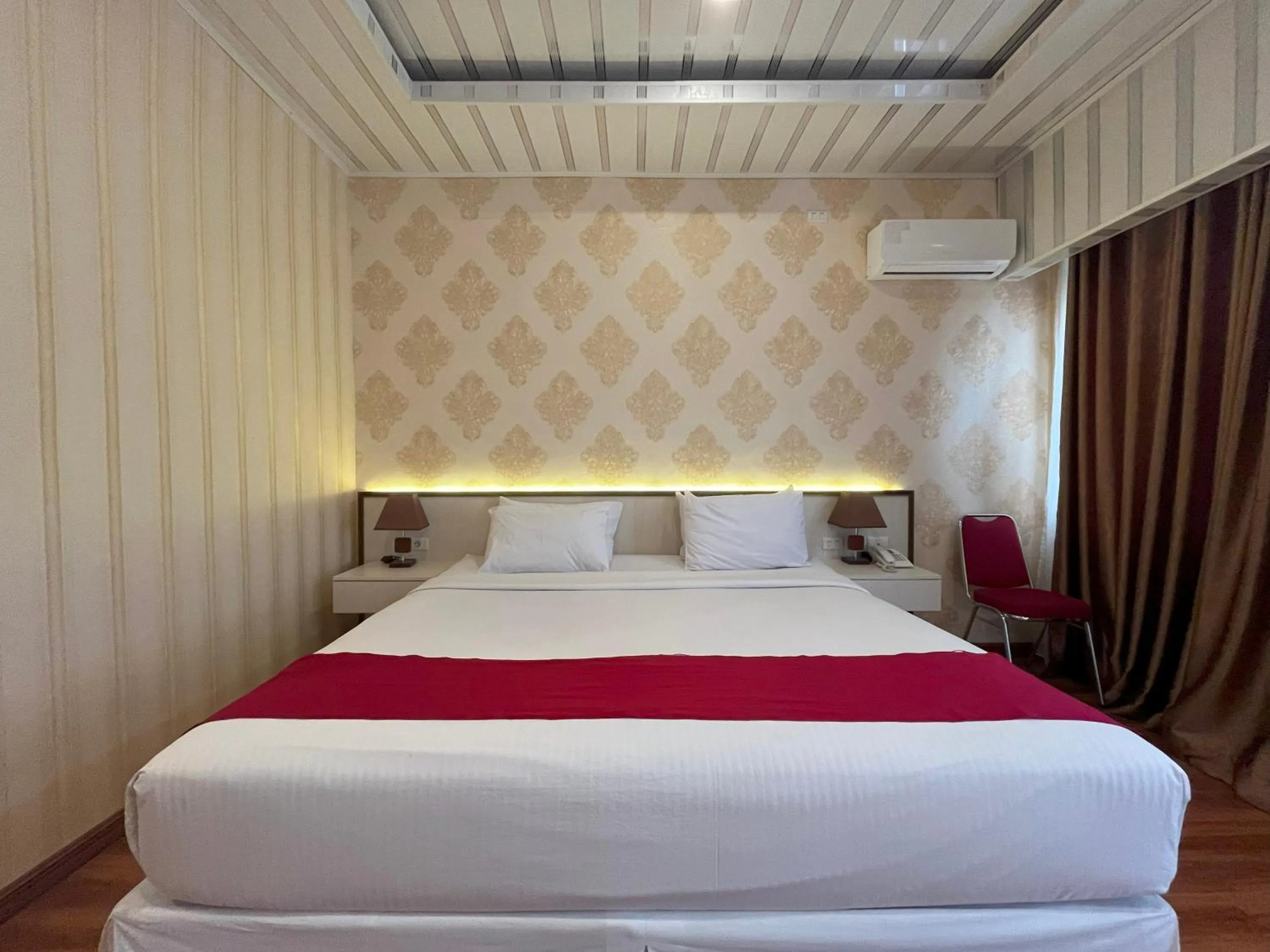 Bed in Grand Tamaro Hotel