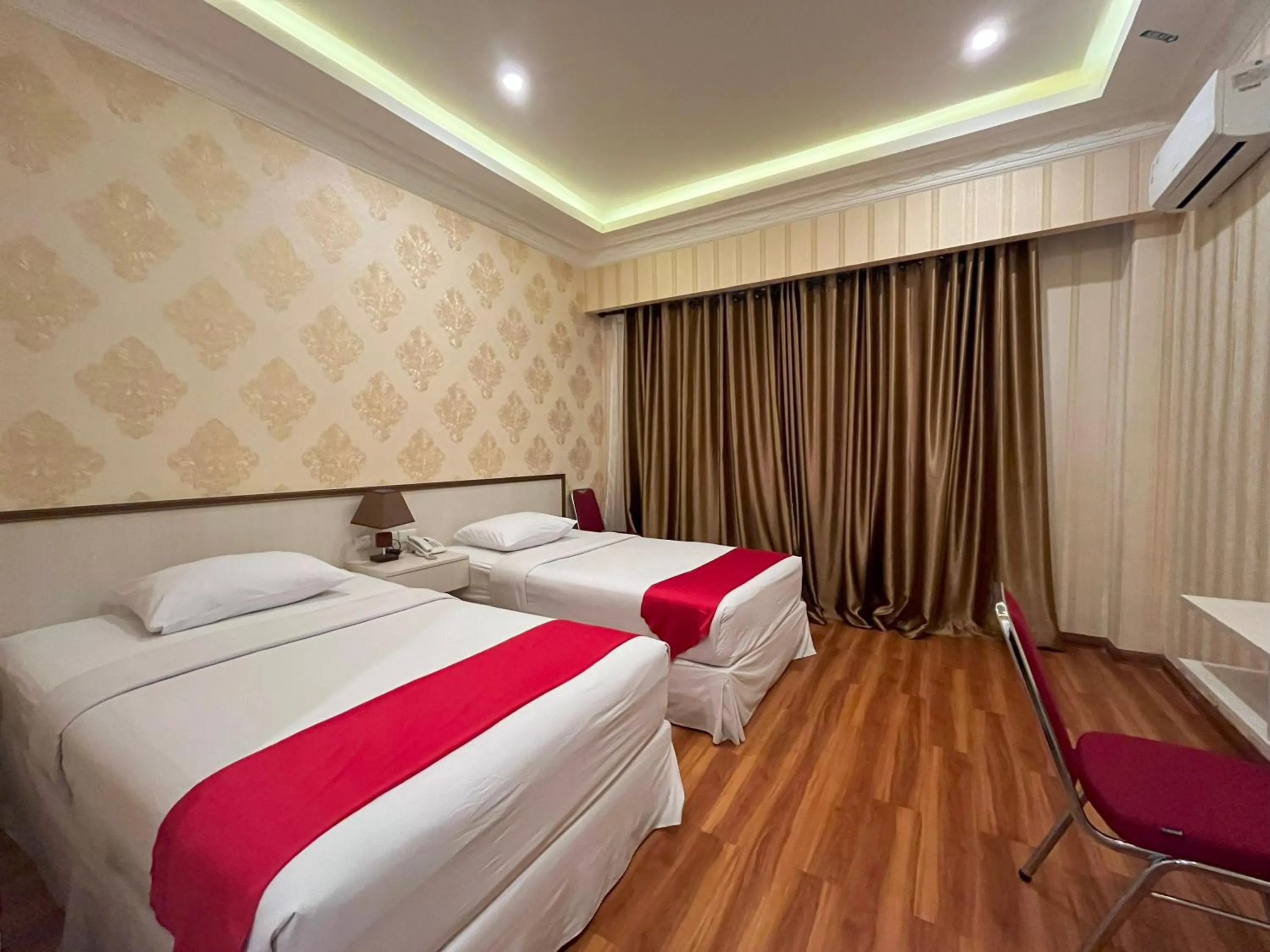 Bed in Grand Tamaro Hotel