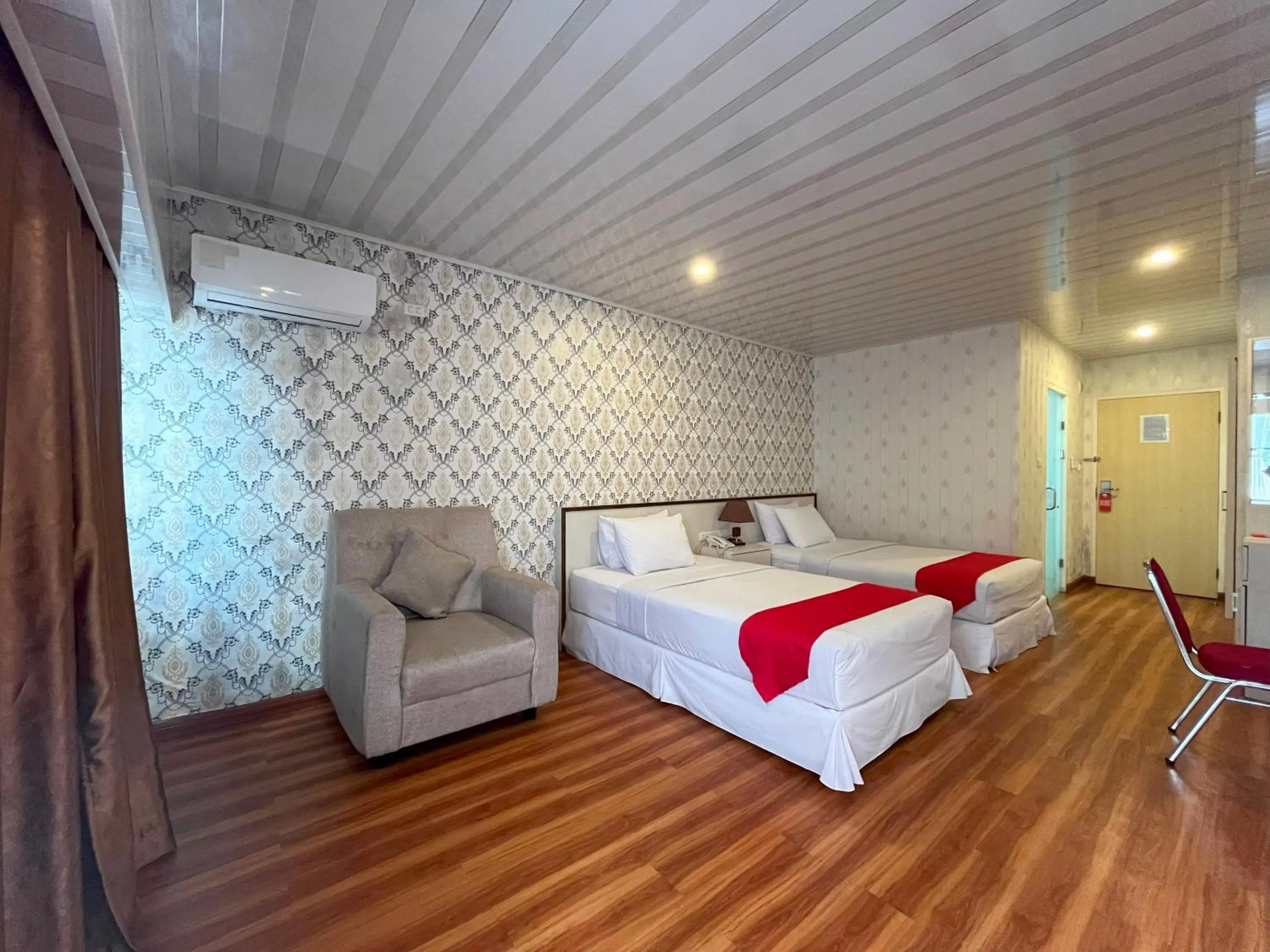 Bed in Grand Tamaro Hotel