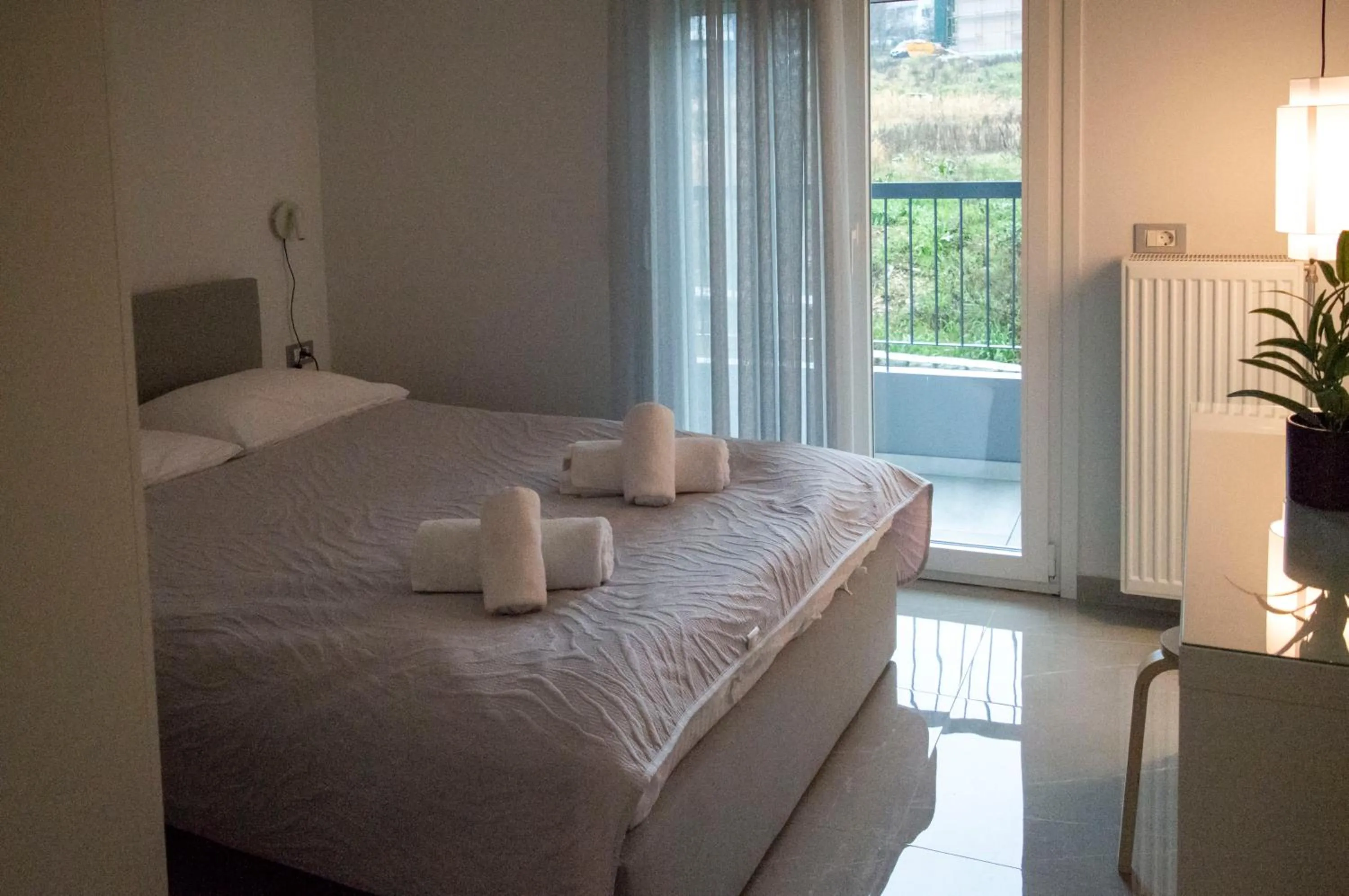 Bed in AK Apartments Ioa