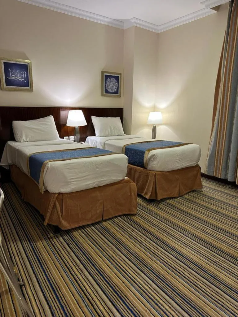 Bed in Arkan Al Manar Hotel