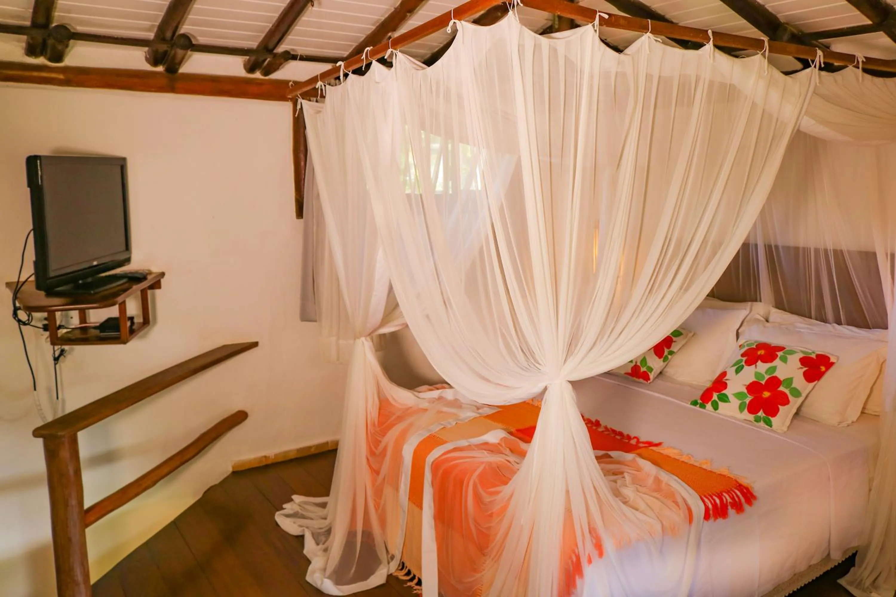 Bed in Pousada Hibisco