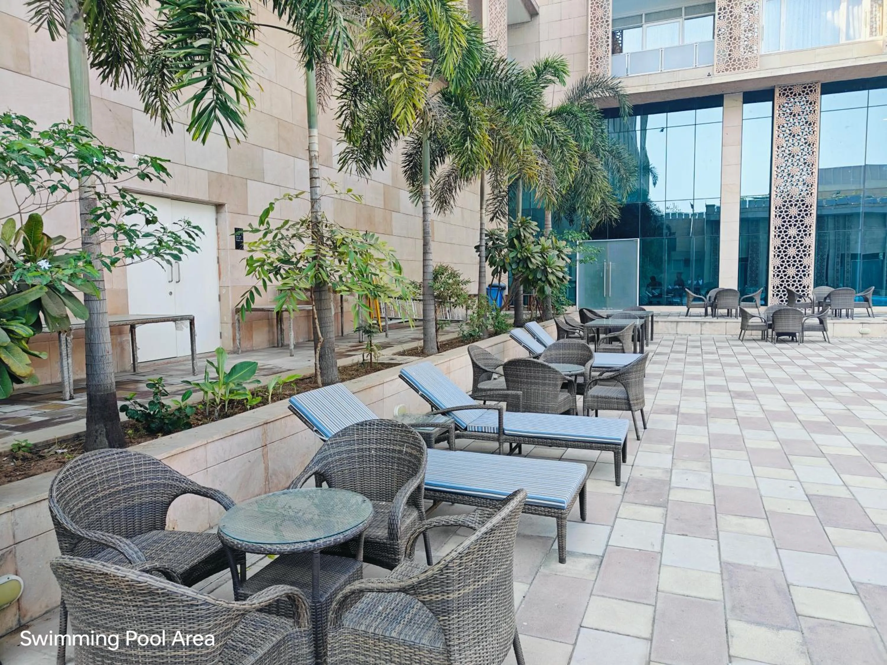 Seating area in Ramada by Wyndham Ahmedabad Narendra Modi Stadium Motera