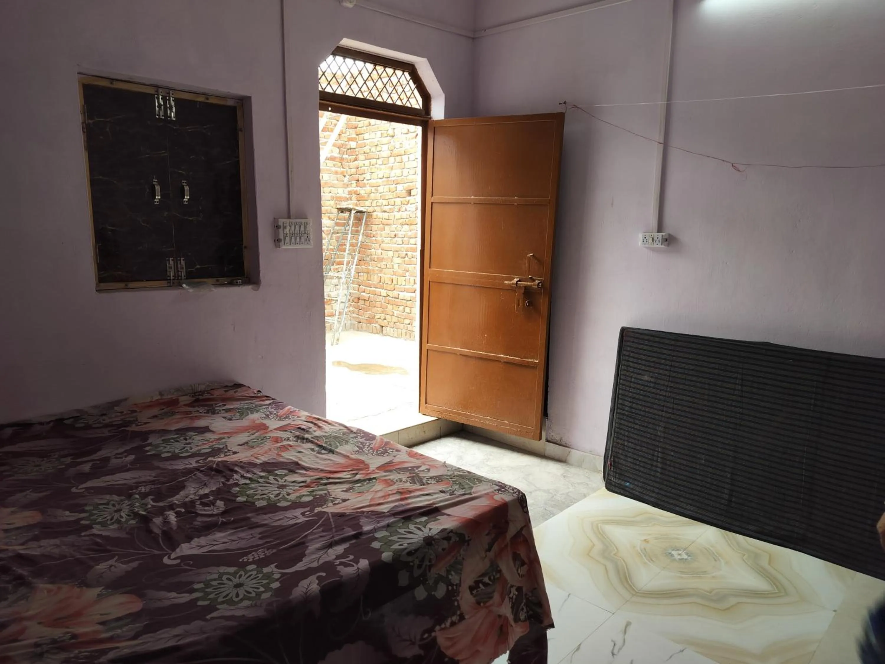 Bed in Shri Krishna Kunj homestay
