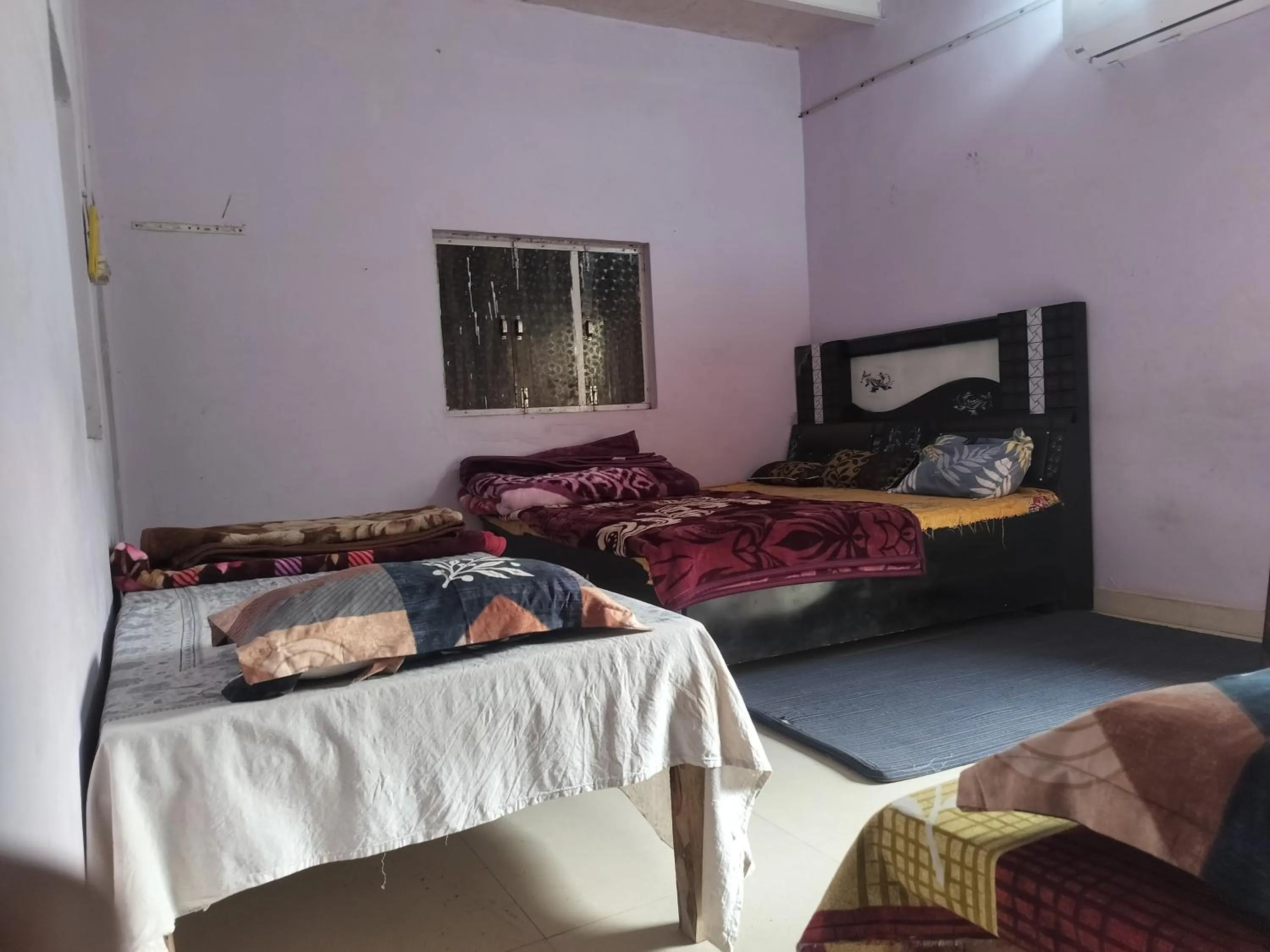Bed in Shri Krishna Kunj homestay