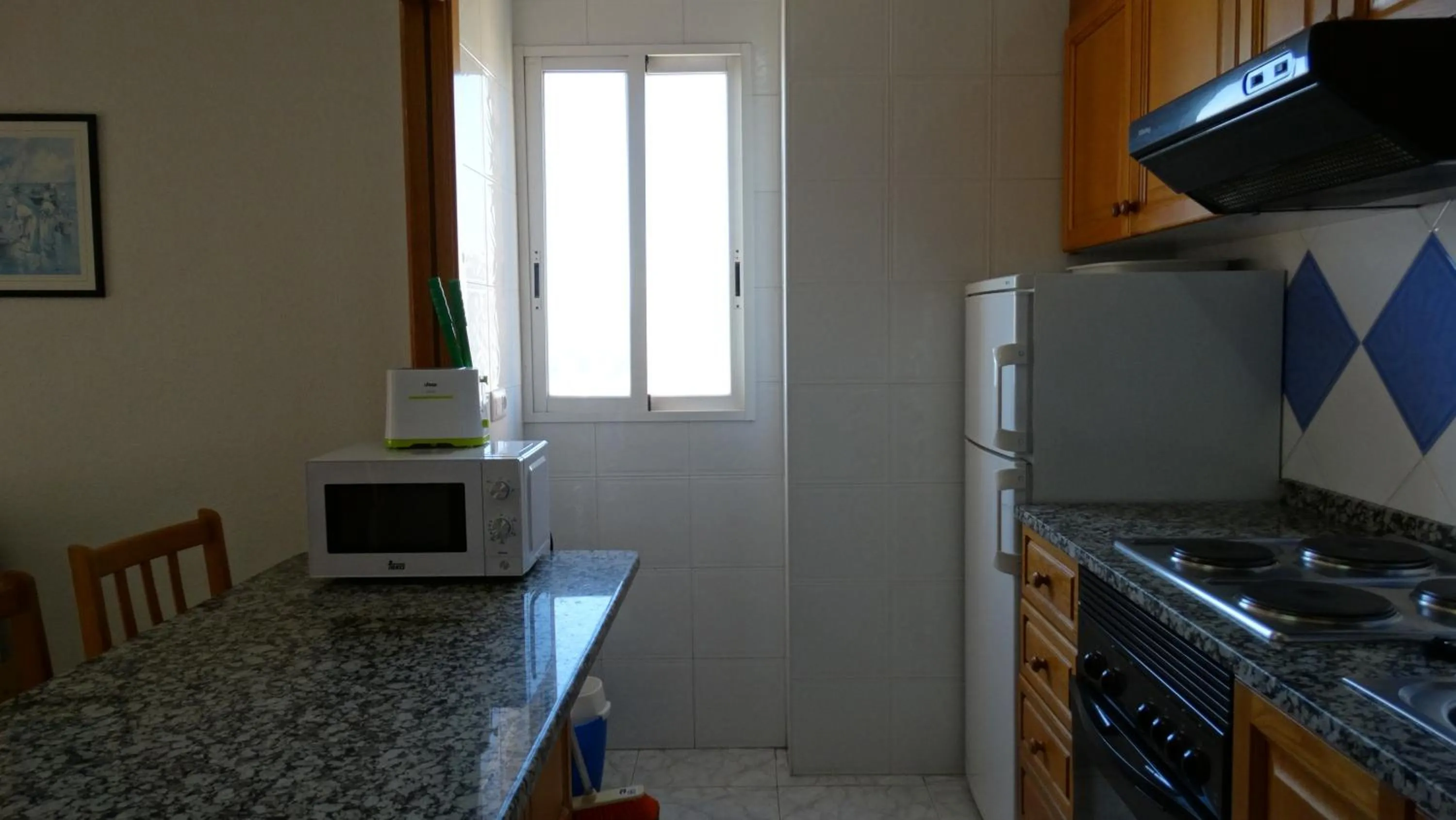 Kitchen or kitchenette in Apartamentos Beni-Beach