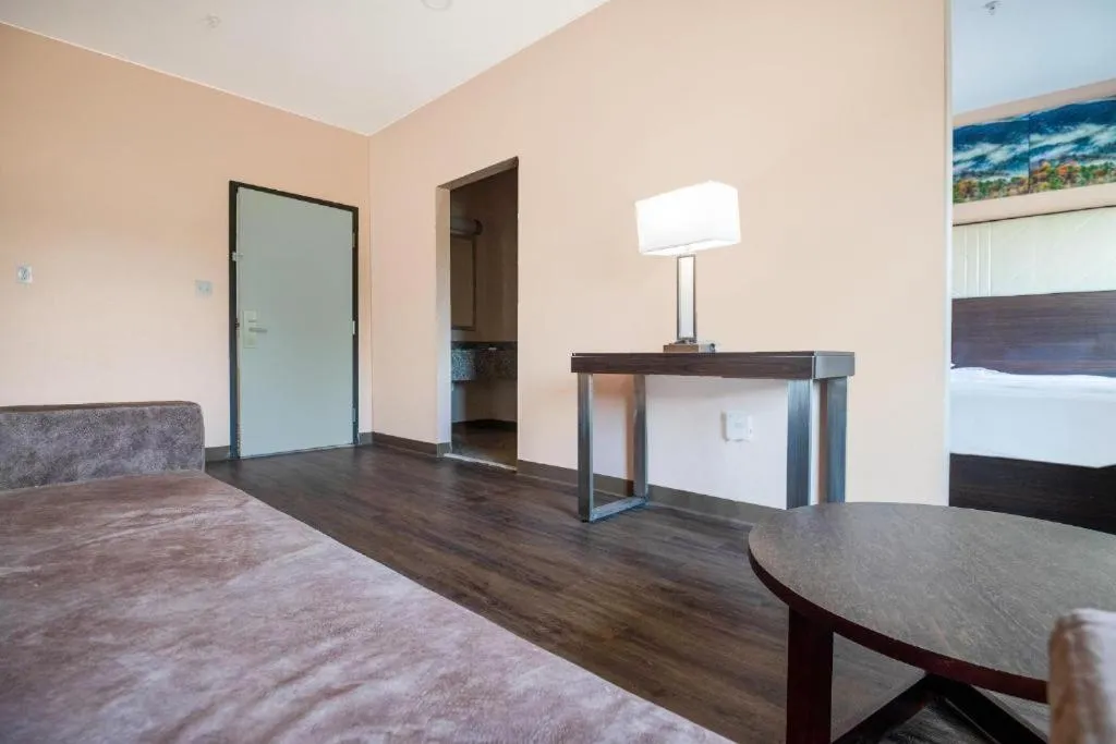 Bed in Royal Inn & Suites