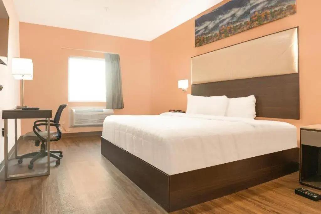 Bed in Royal Inn & Suites Bed in Royal Inn & Suites