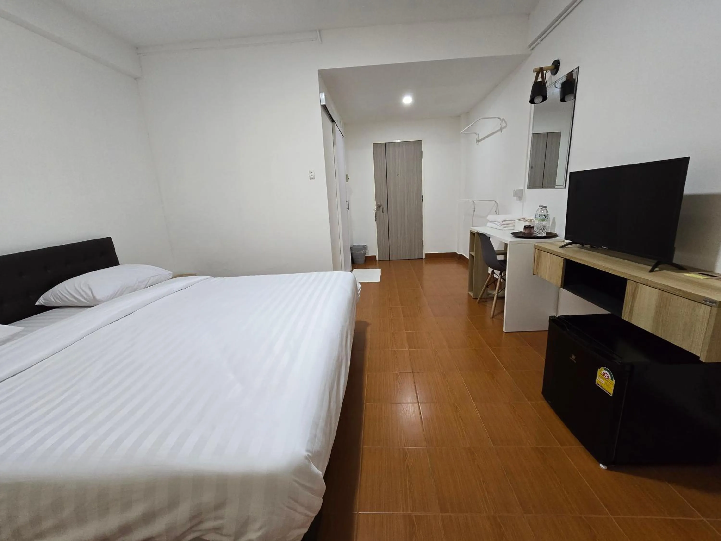 Bed in Ratanasiri Hotel