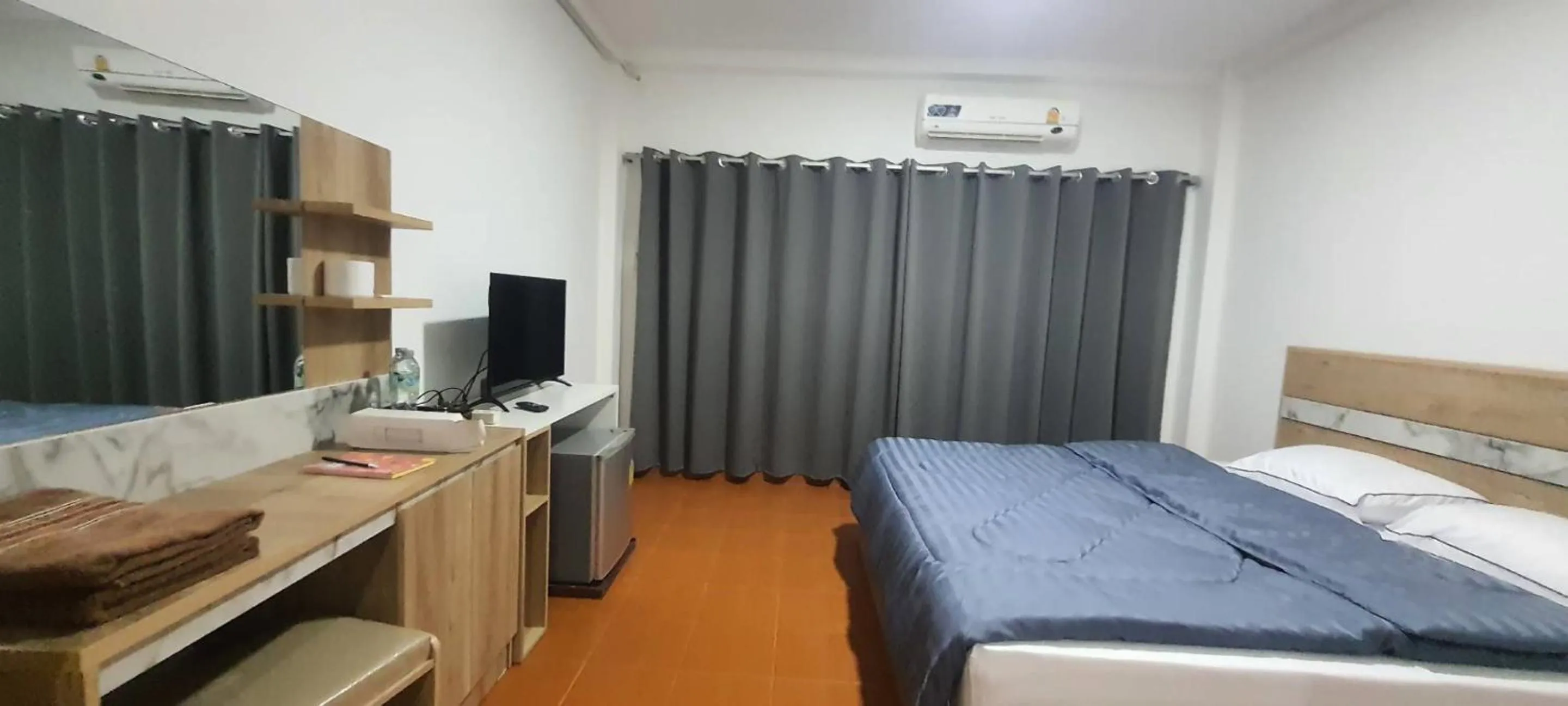 Bed in Ratanasiri Hotel