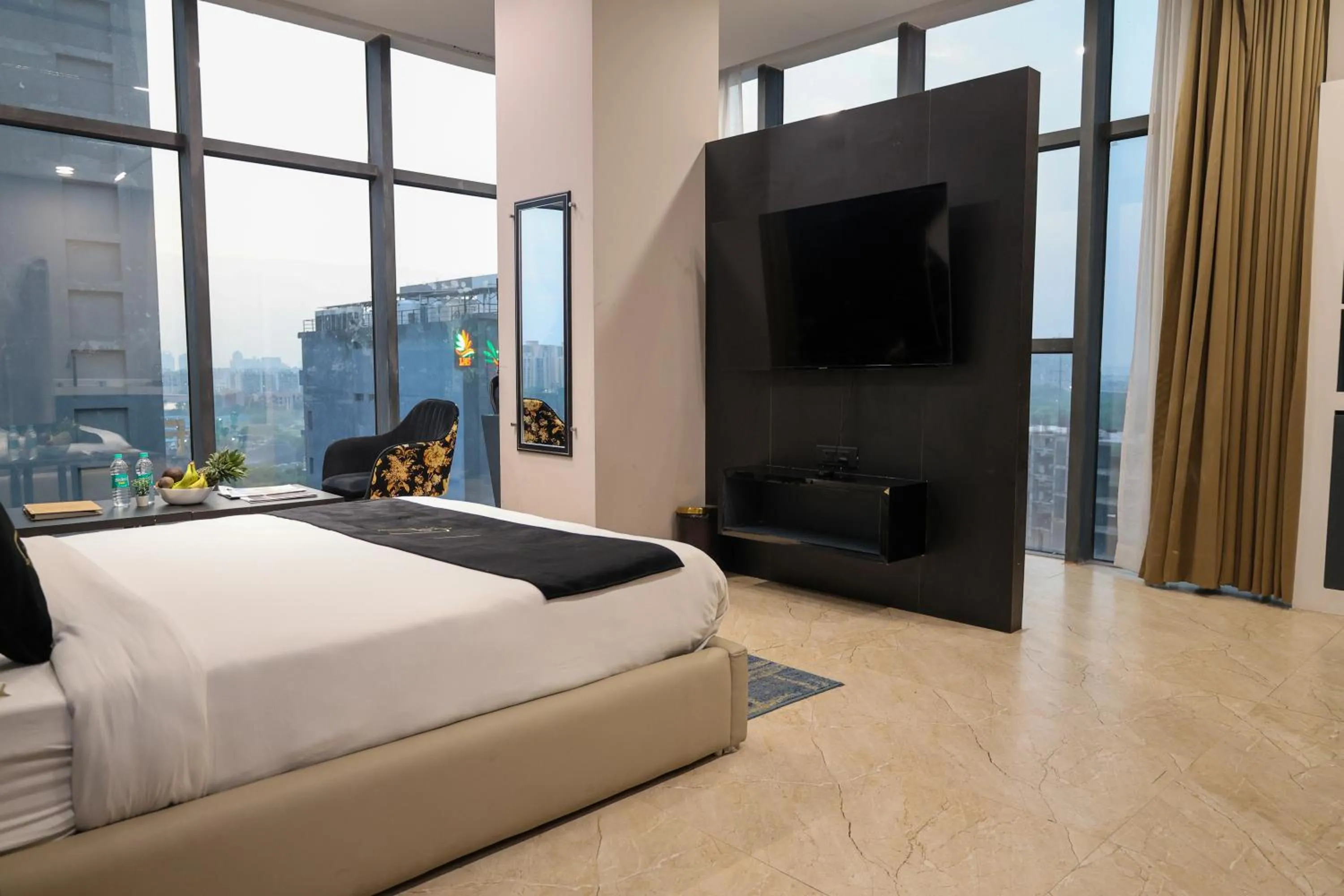 Photo of the whole room, Bed in Aquila Grand Suites - Noida Sector 136