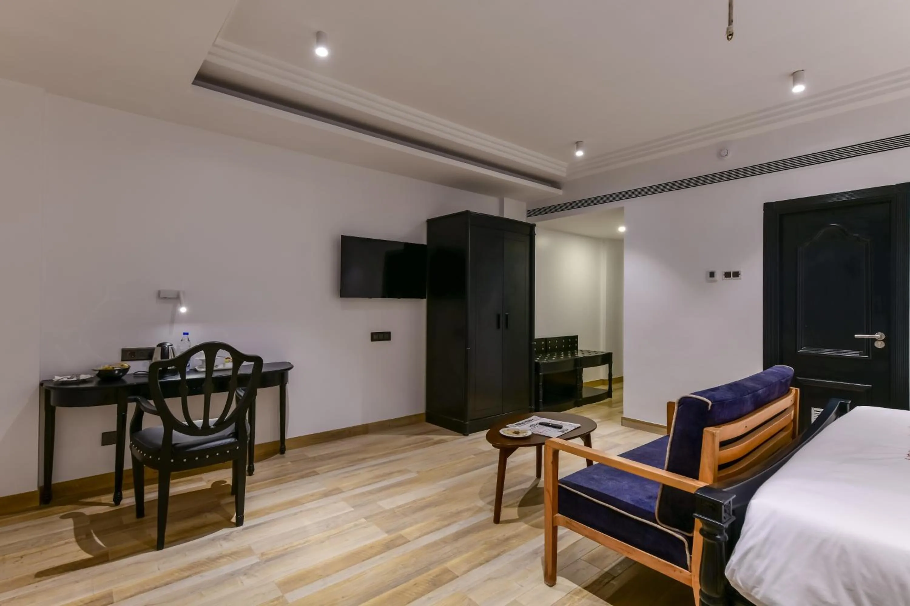 Seating area, Bed in Regenta Inn Downton Raipur