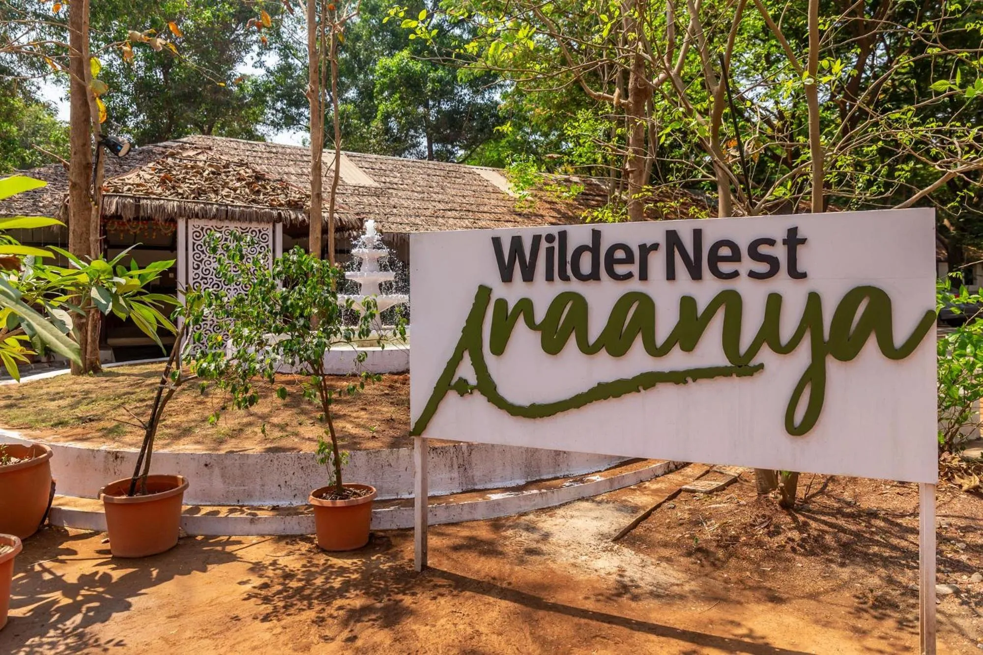 Property logo or sign in WilderNest Araanya by Vibescapes