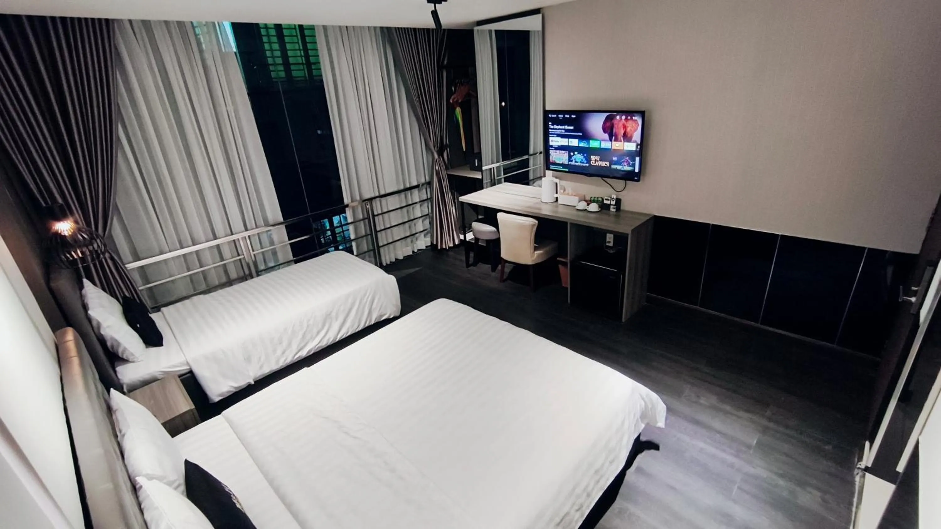 Bed in M&H Lux Hotel
