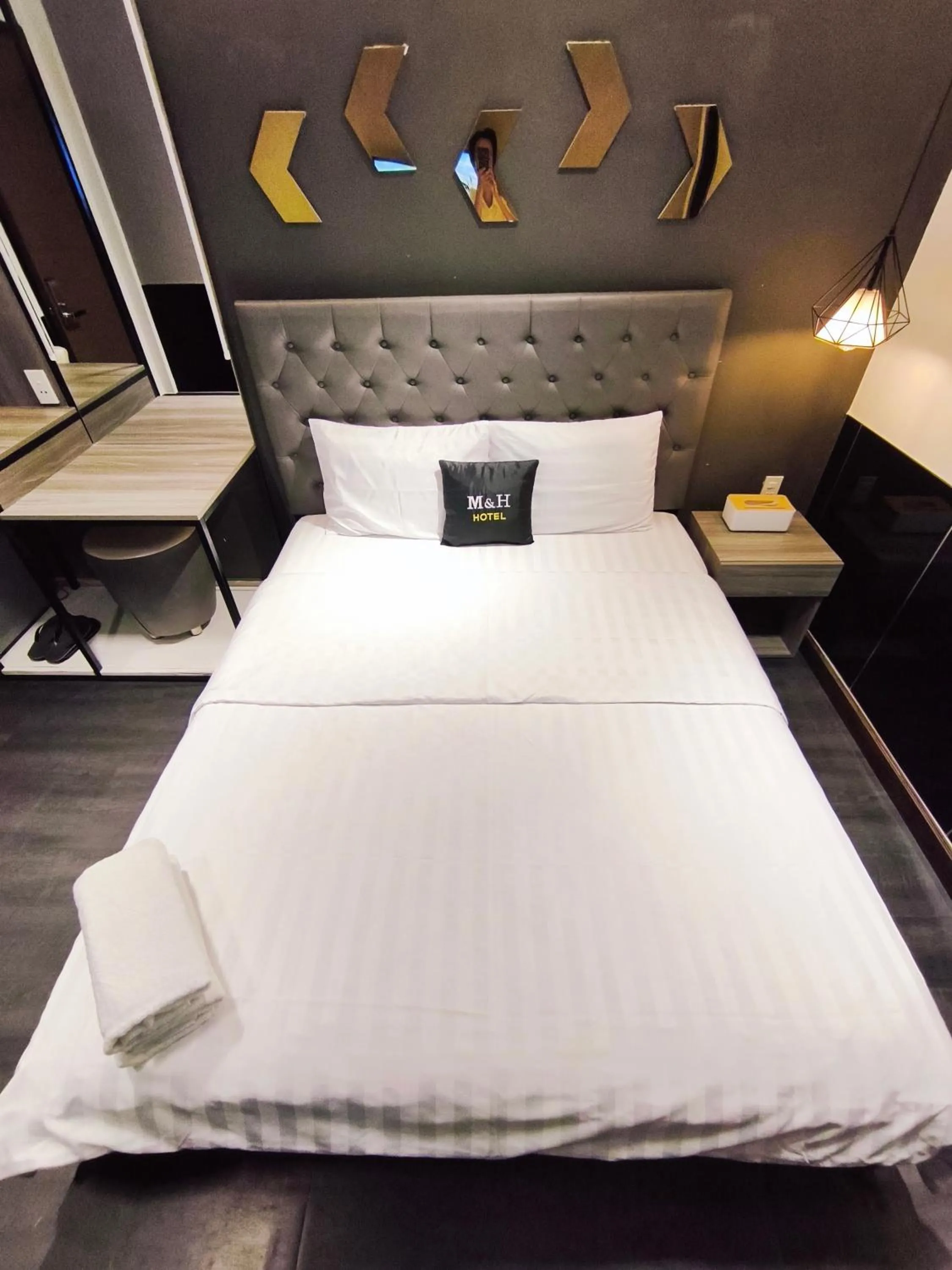 Bed in M&H Lux Hotel