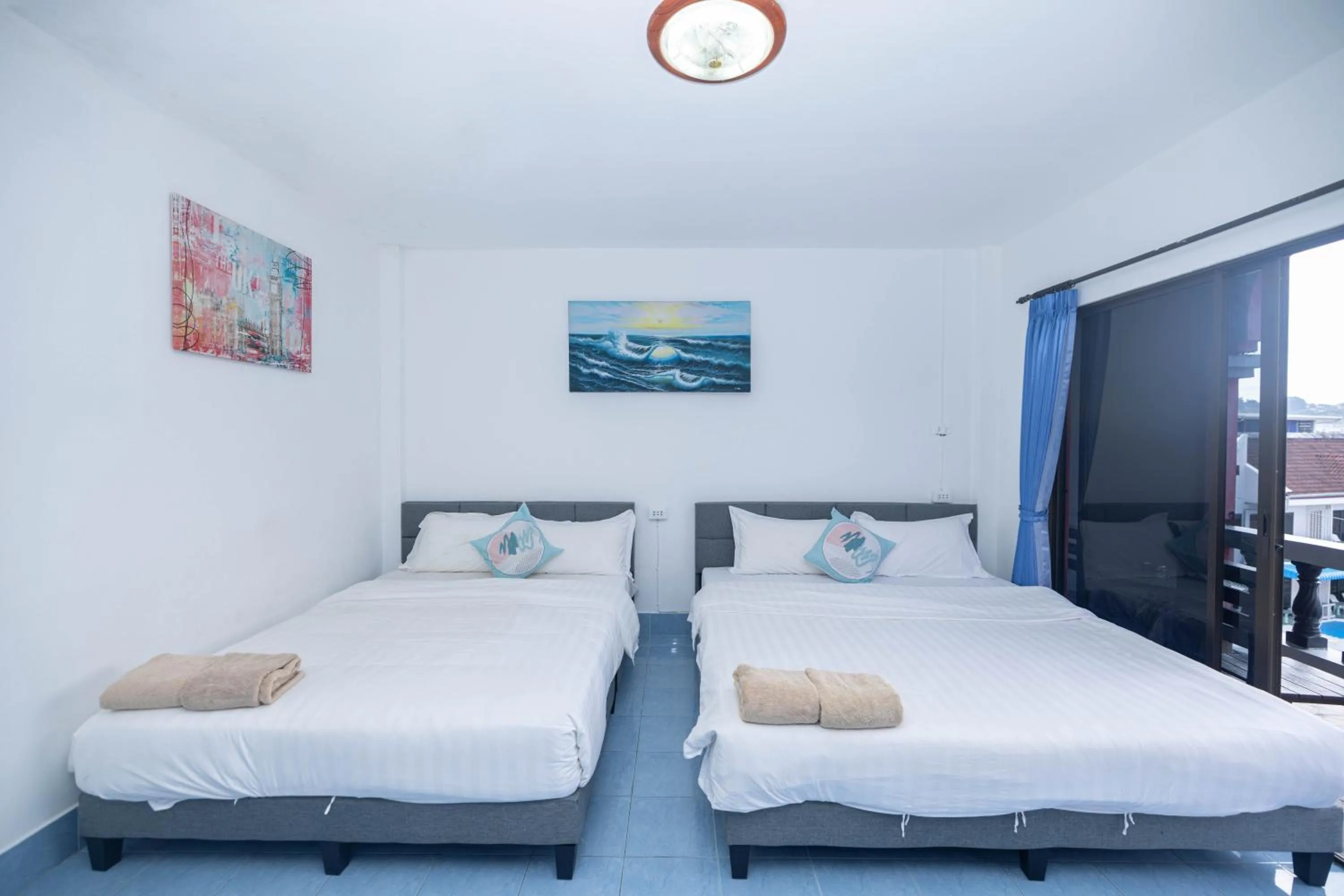 Bed in Belle Cose Guest House Phuket