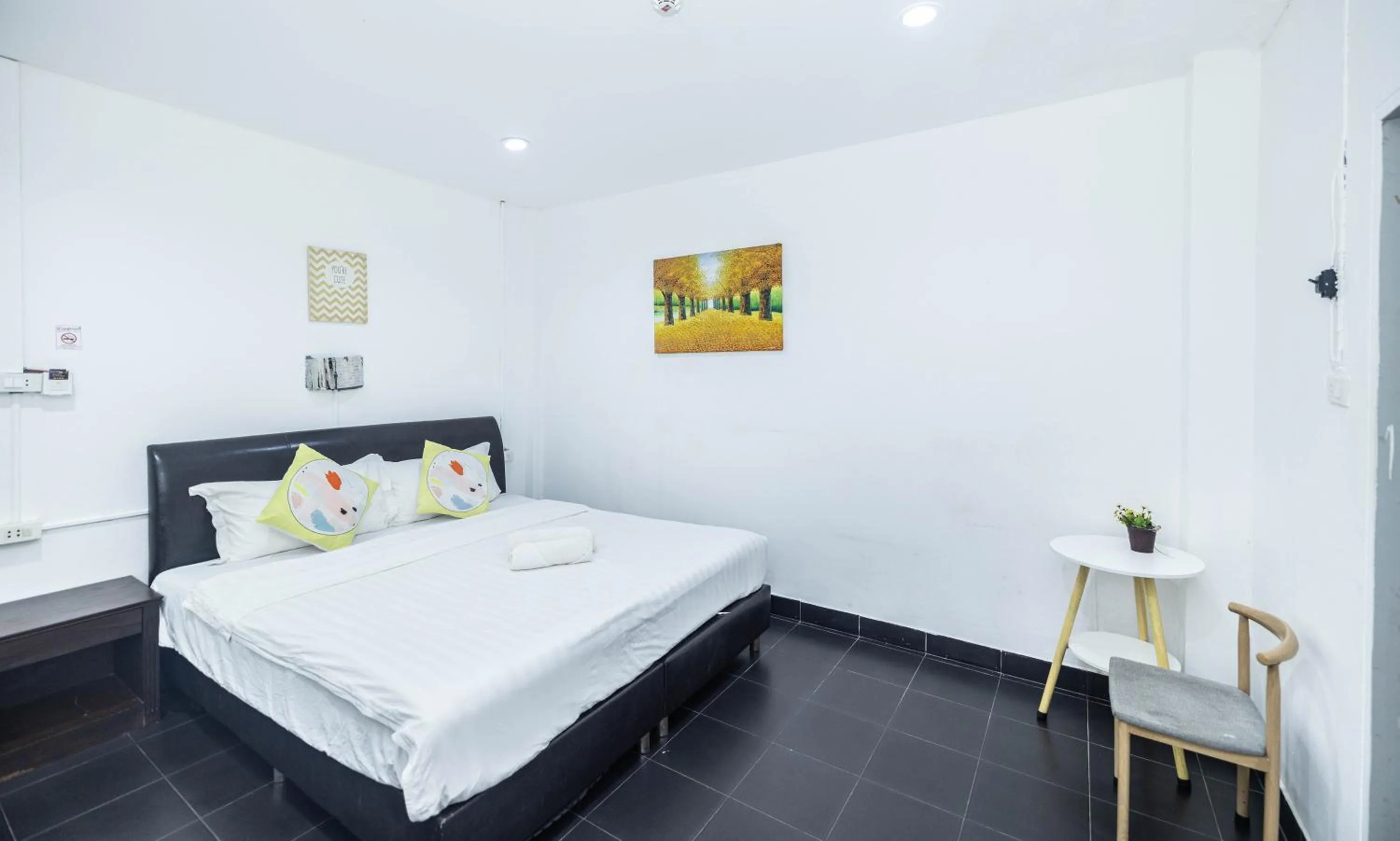 Bed in Belle Cose Guest House Phuket