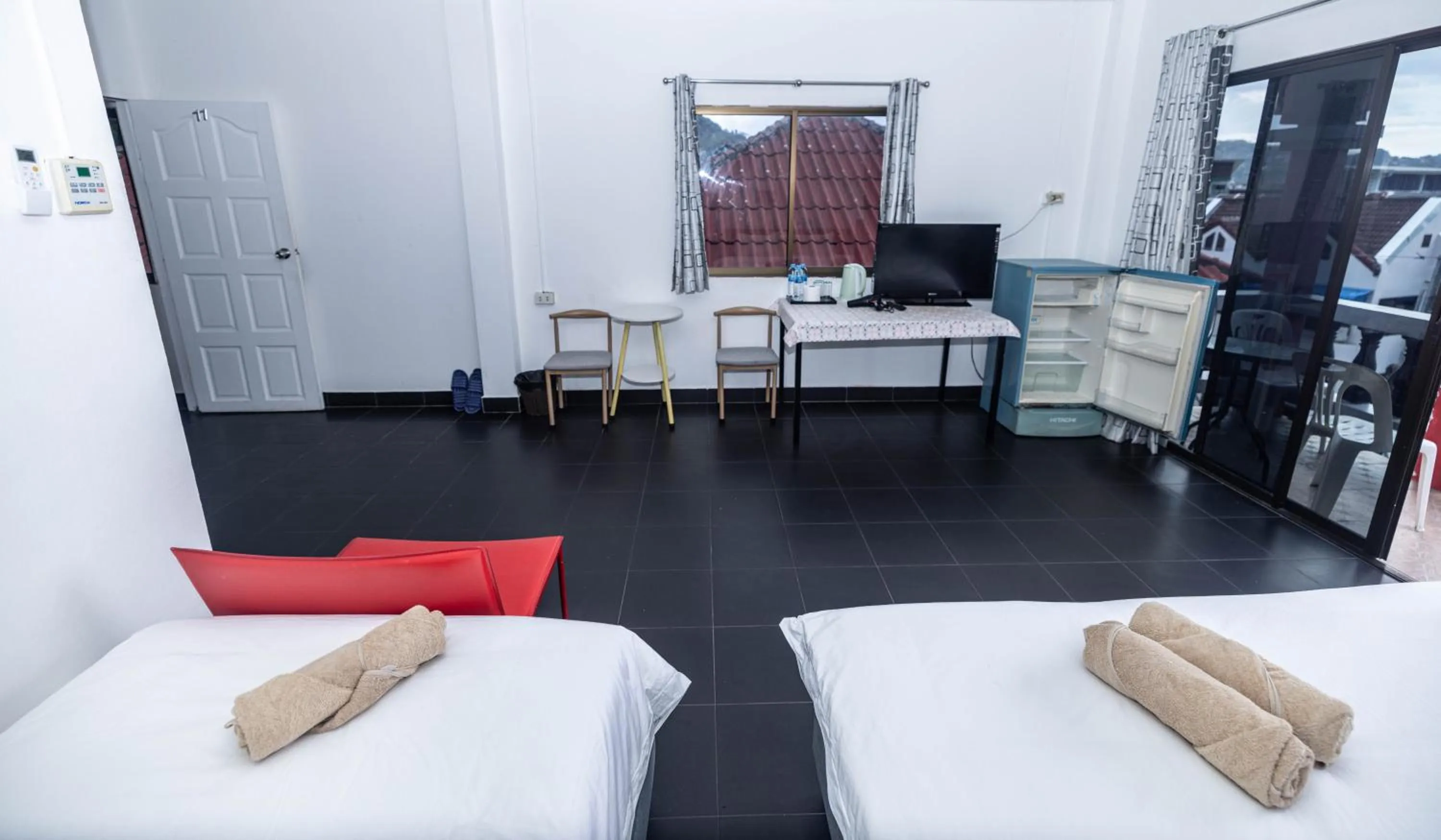 Bed in Belle Cose Guest House Phuket