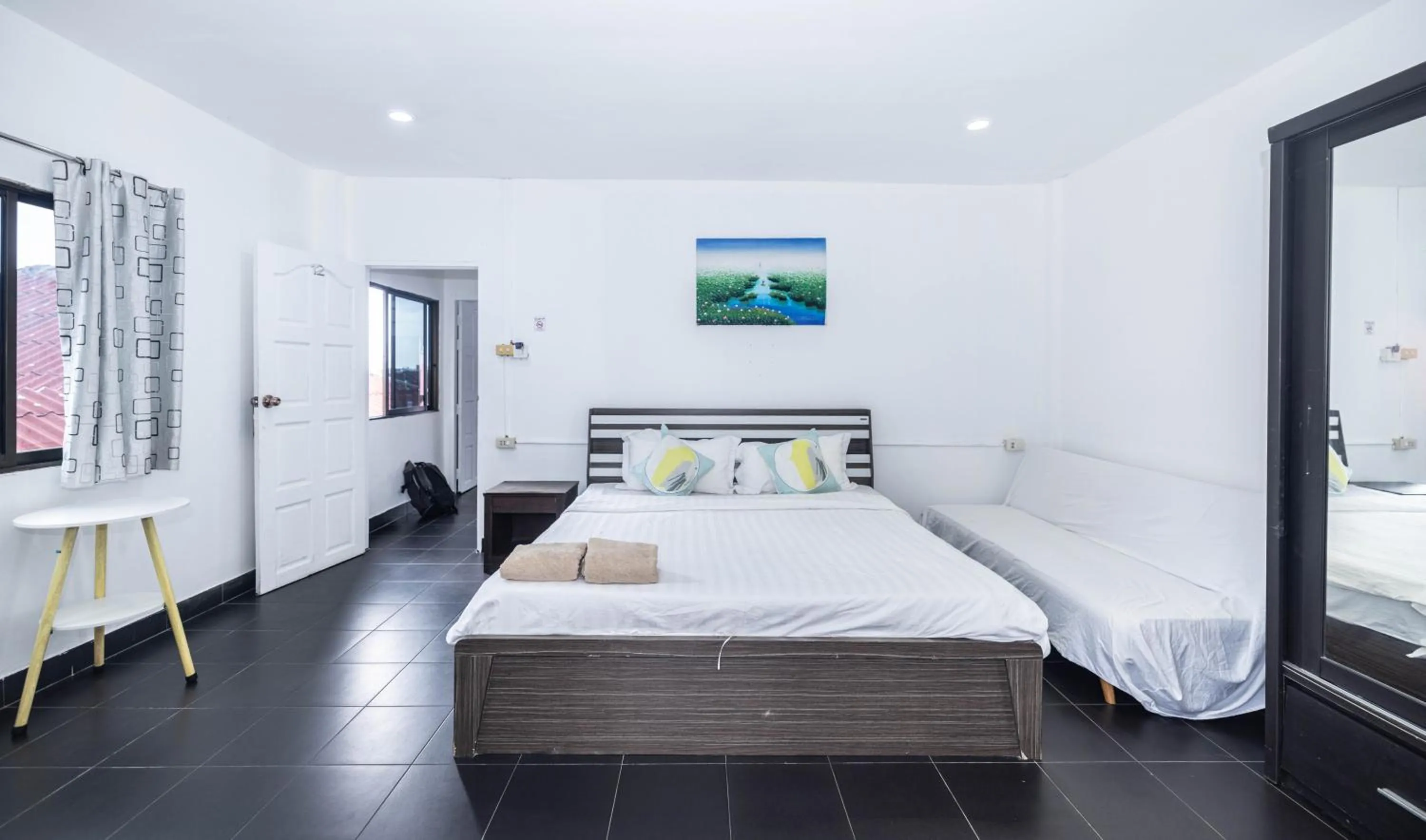 Bed in Belle Cose Guest House Phuket