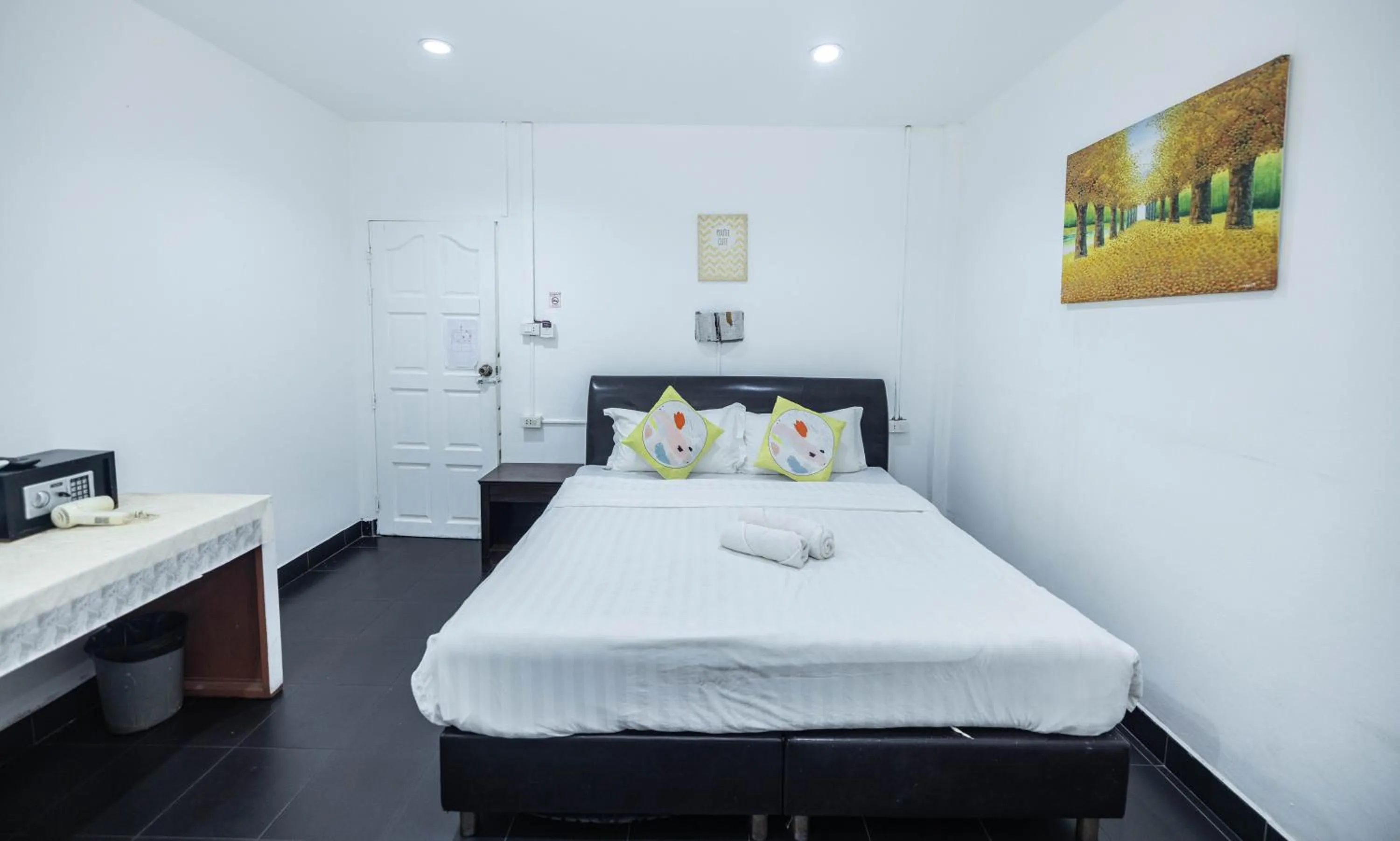 Bed in Belle Cose Guest House Phuket