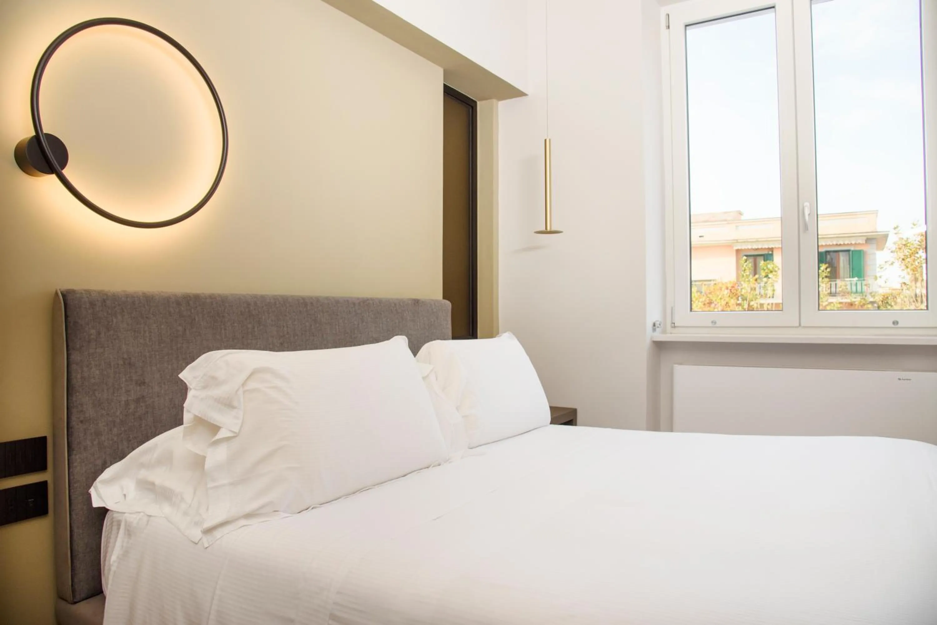 Bed in Vesuvius Palace Aparthotel