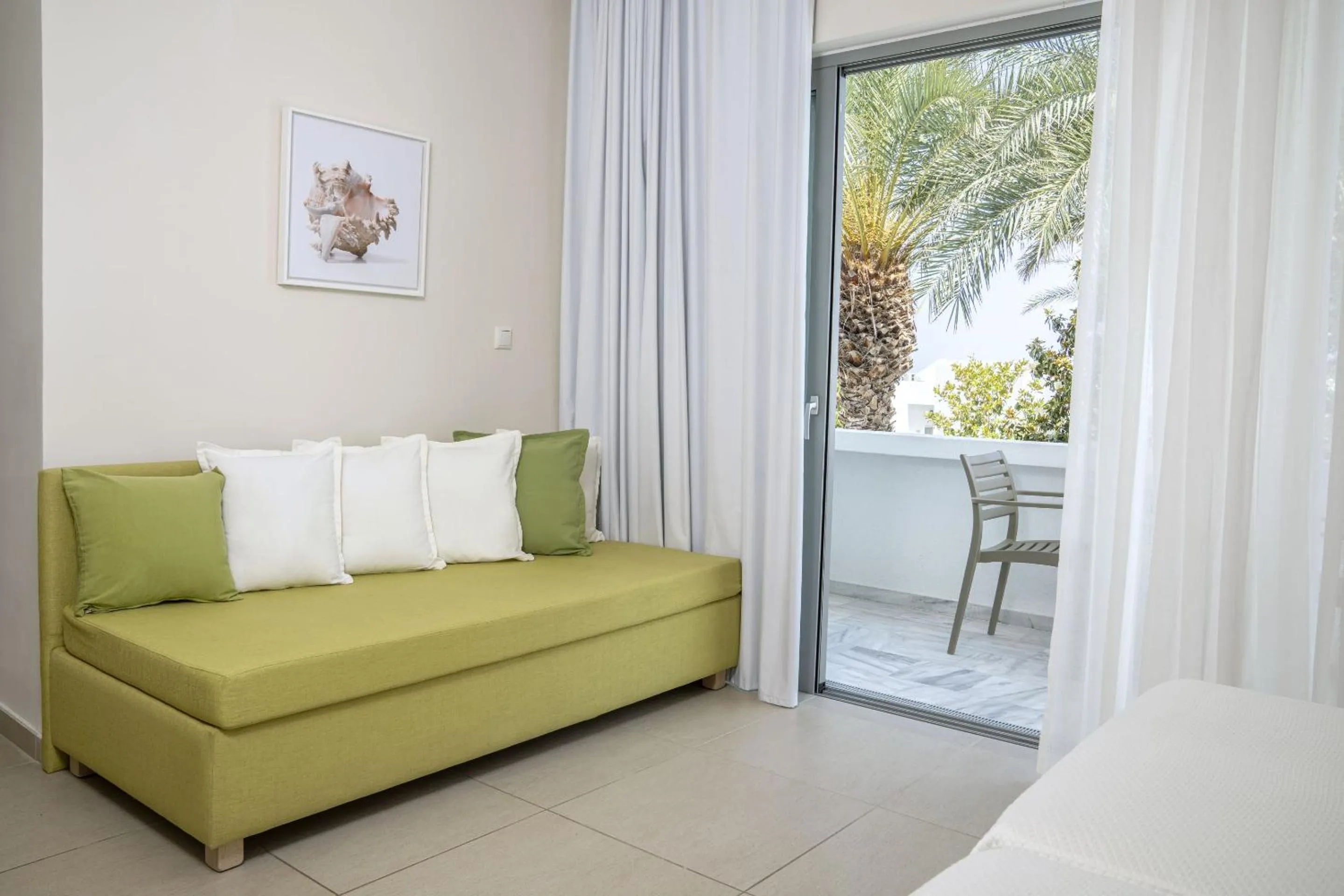 Seating area, Bed in Maritimo Beach Hotel