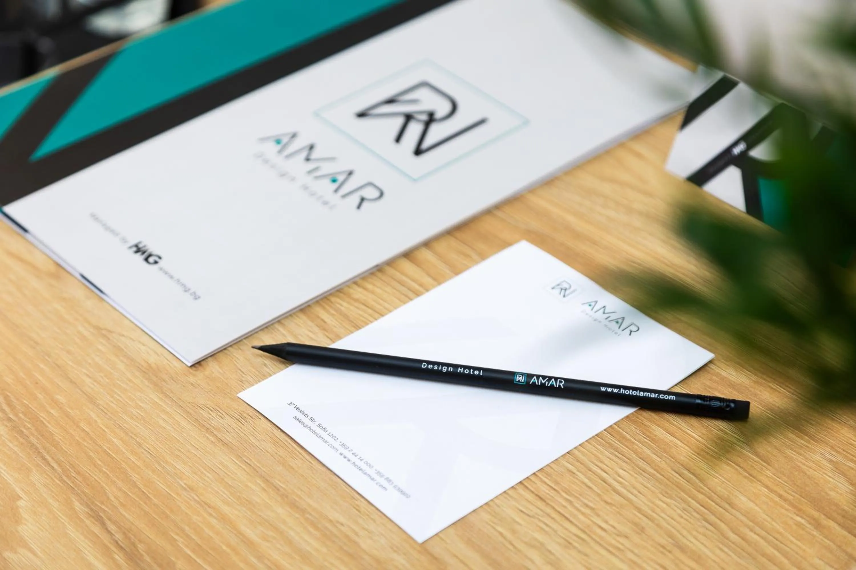 Property logo or sign in AMAR Design Hotel by HMG