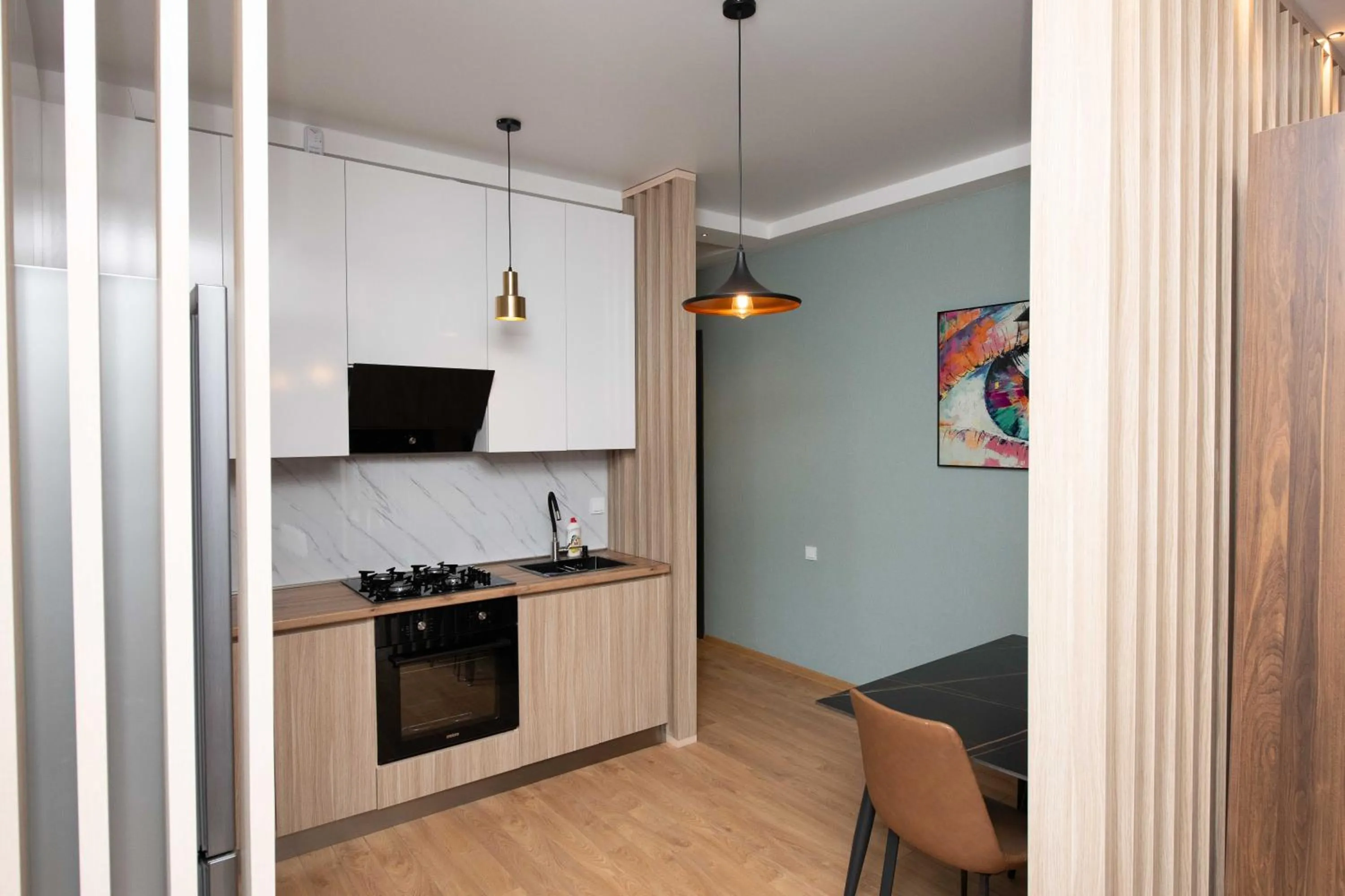Kitchen or kitchenette in Gori Palace - Modern Apartments in City Centre