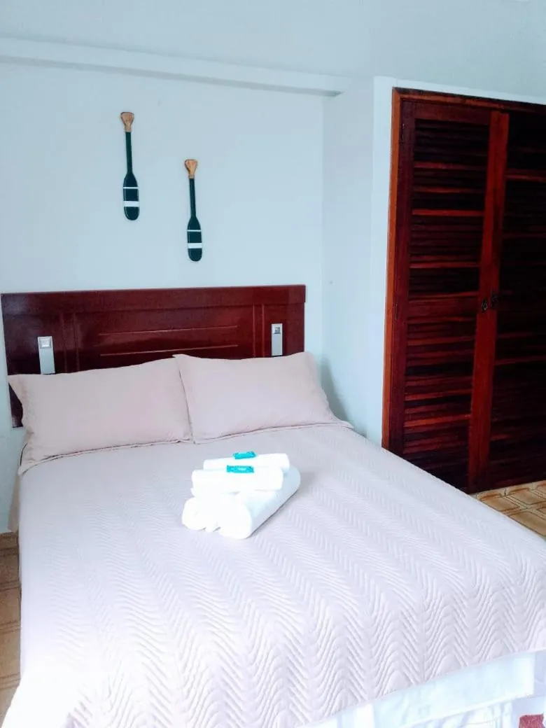 Bed in Pousada Amanhecer do Itaguá