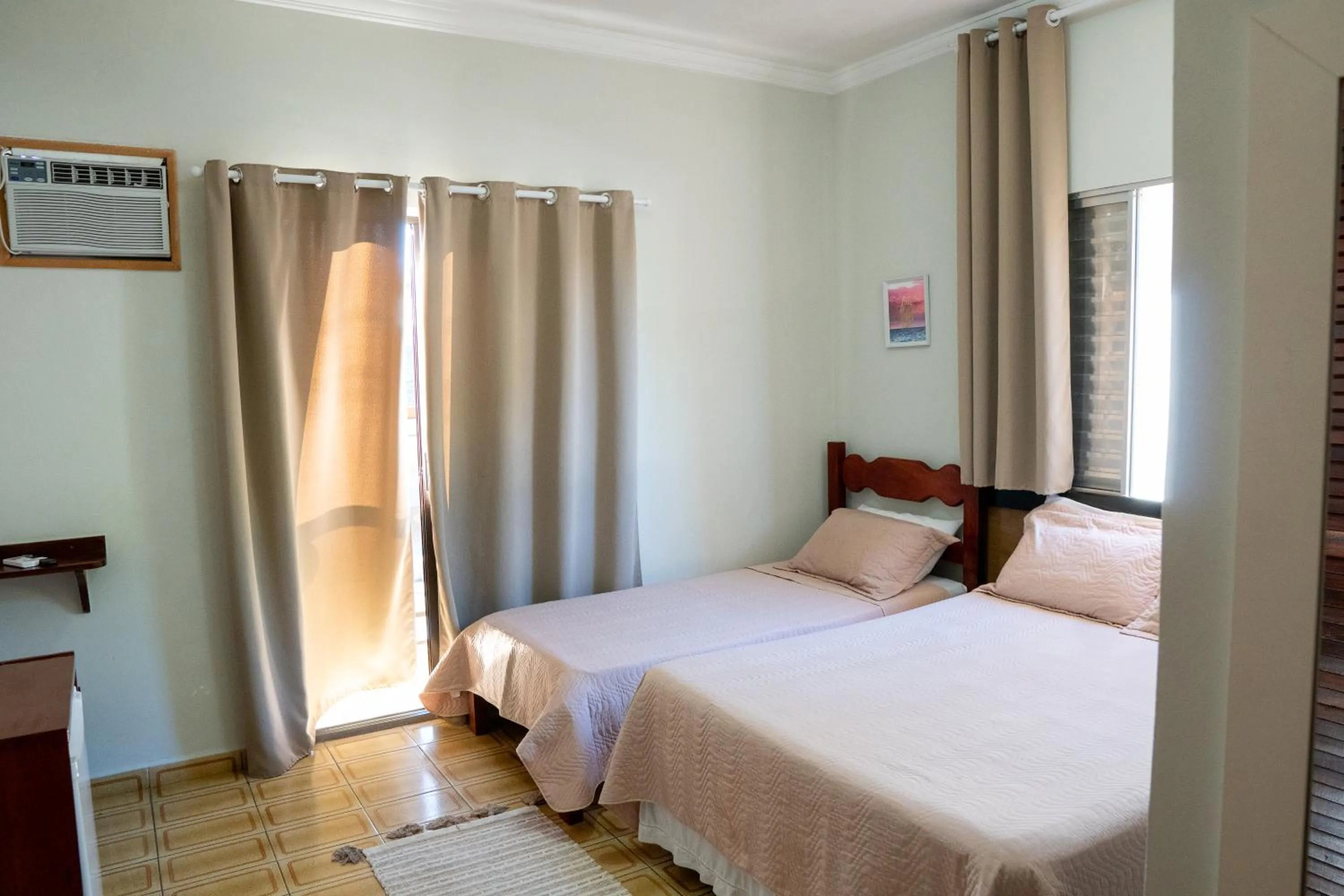 Bed in Pousada Amanhecer do Itaguá