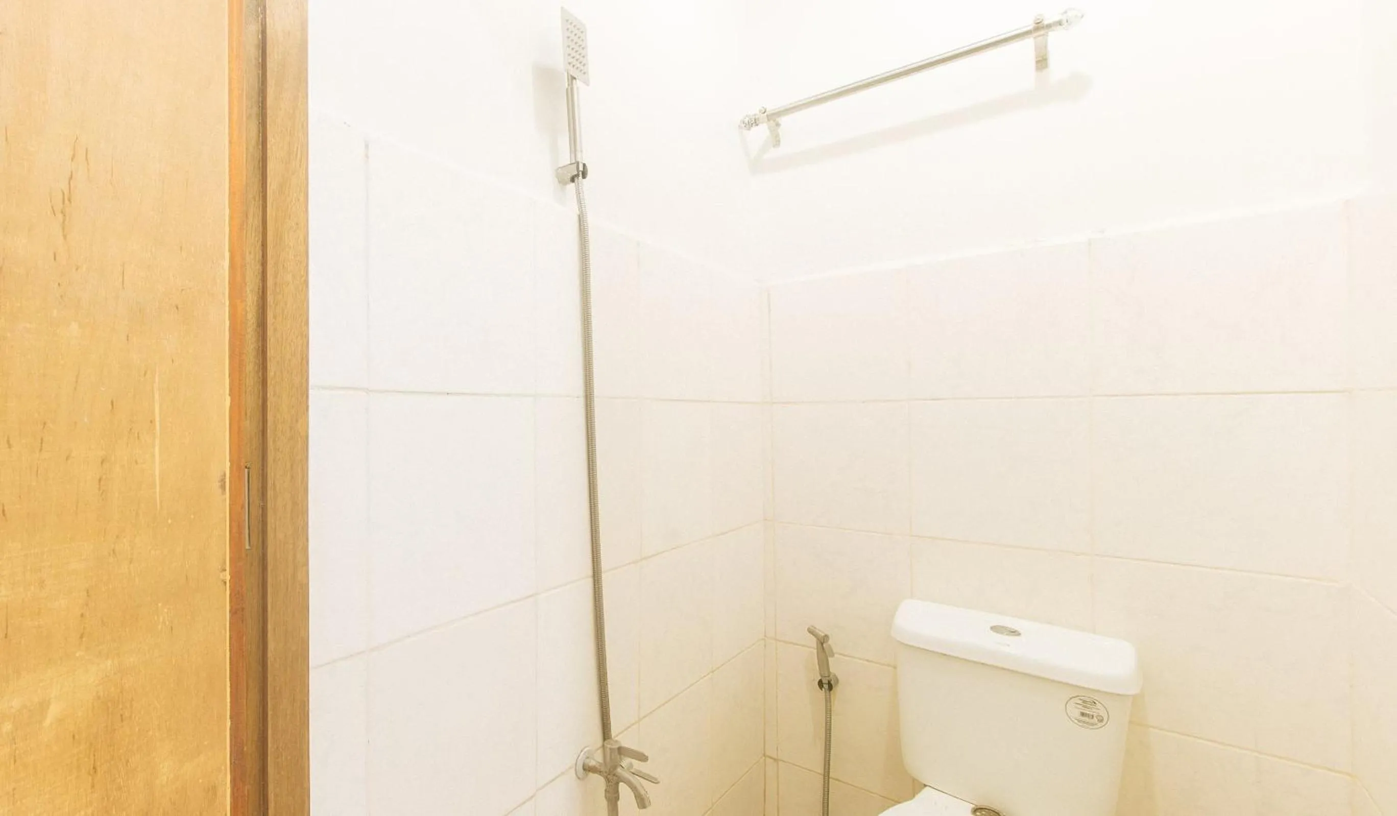 Shower in Cozy Cove Inn by RedDoorz