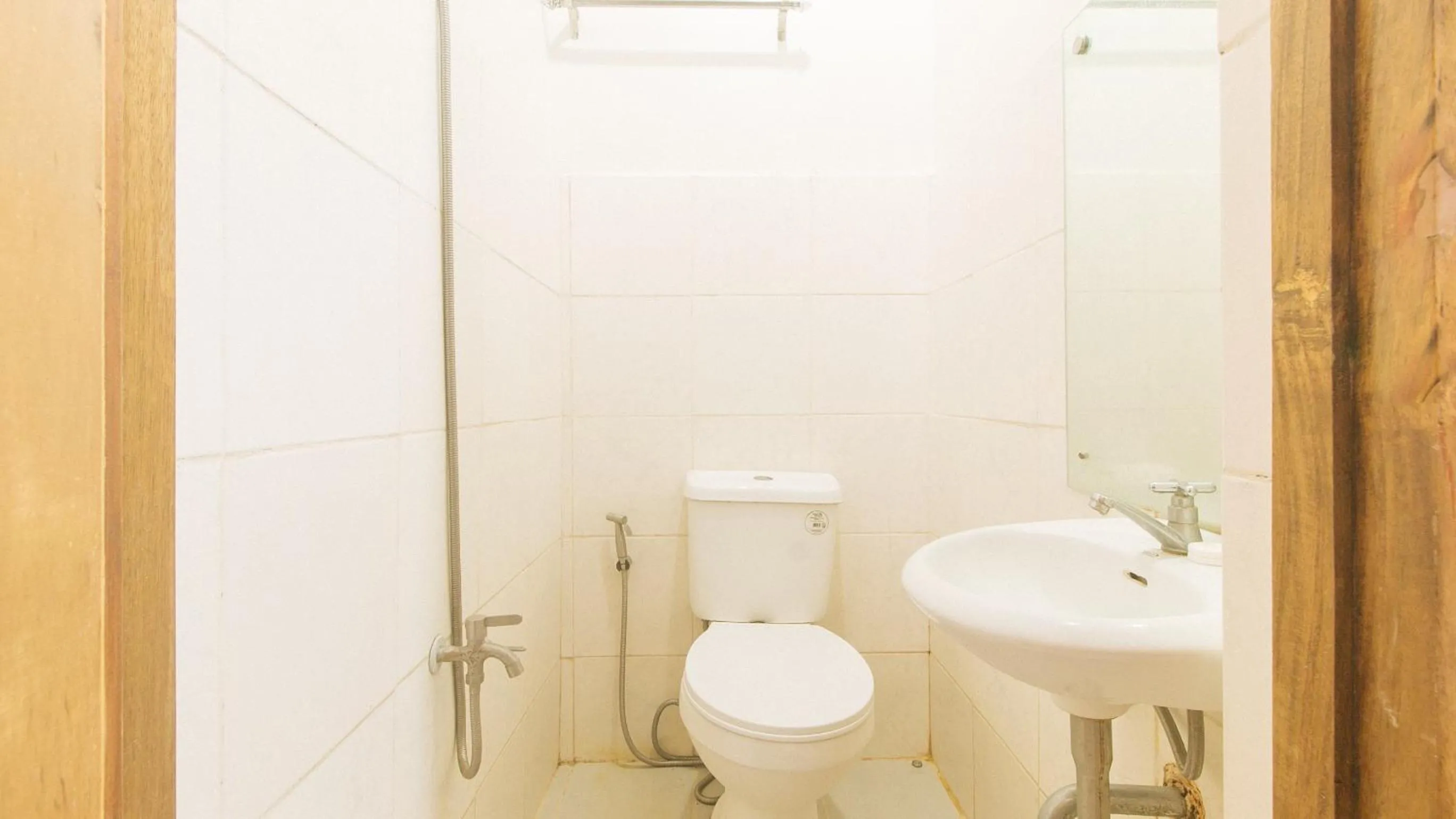 Shower in Cozy Cove Inn by RedDoorz