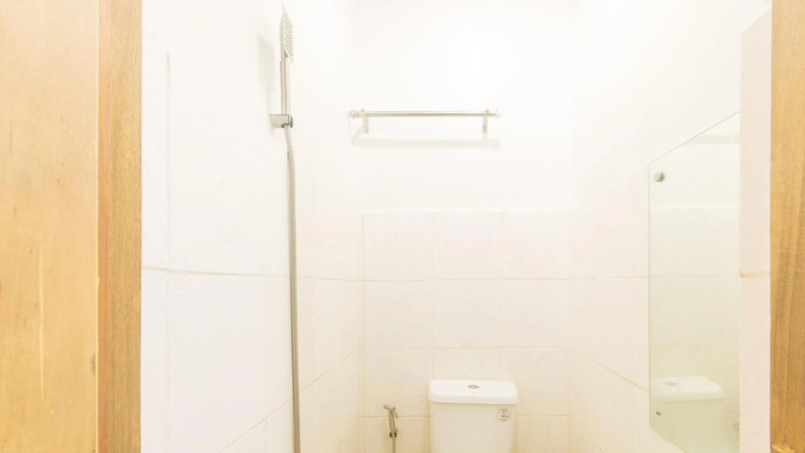 Shower in Cozy Cove Inn by RedDoorz