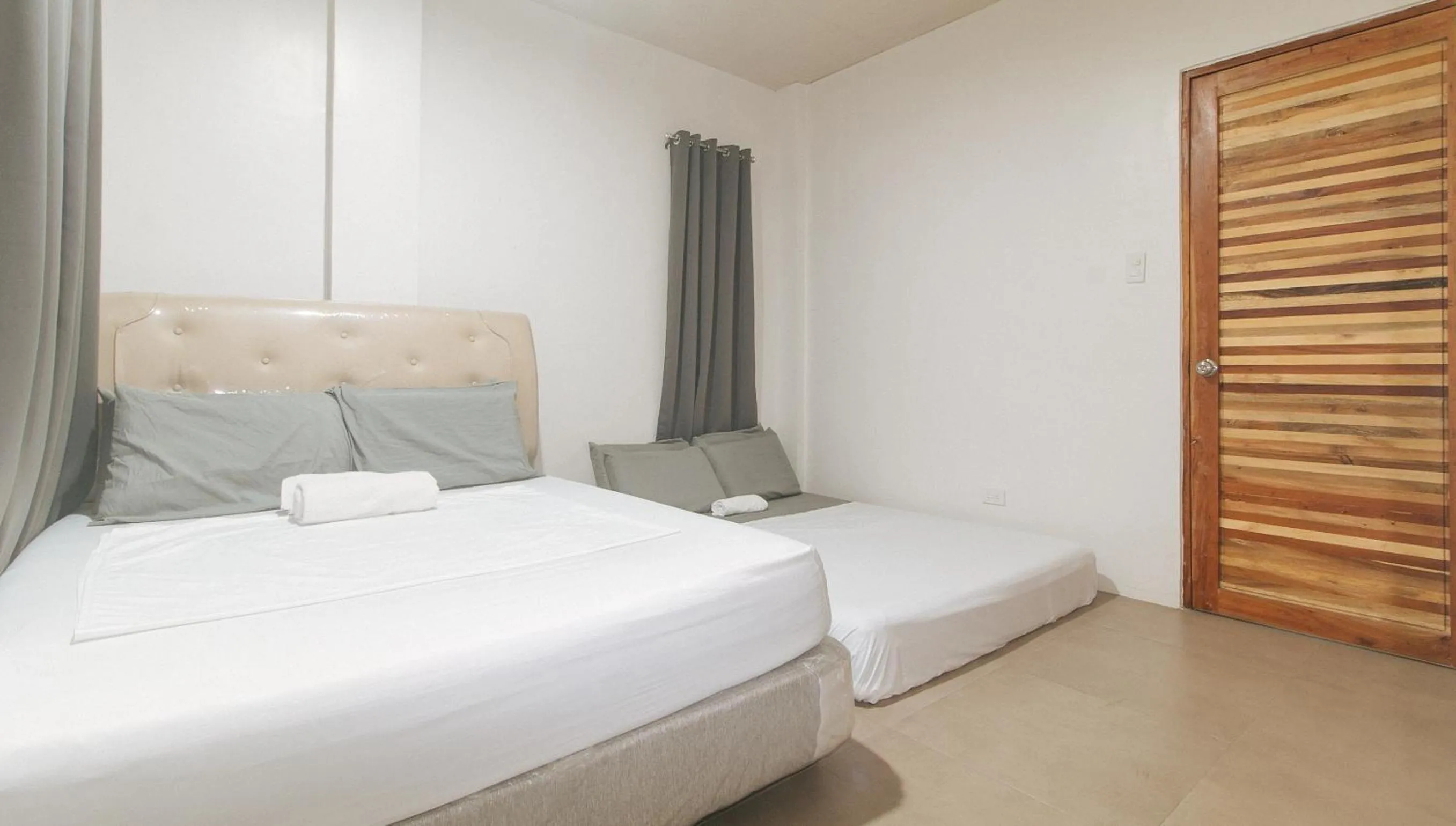 Bed in Cozy Cove Inn by RedDoorz