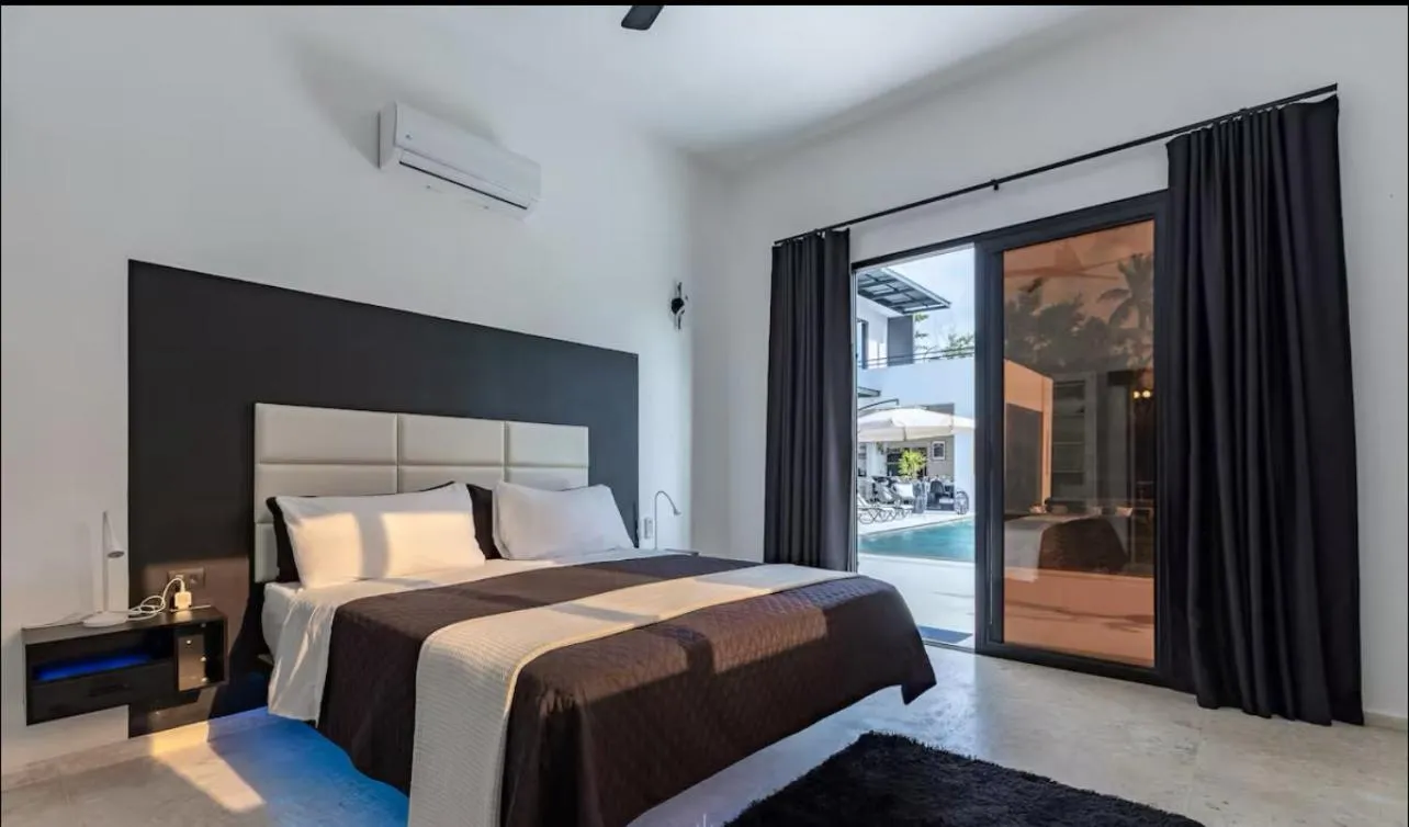 Bed in Casa Black and White Frente al Mar