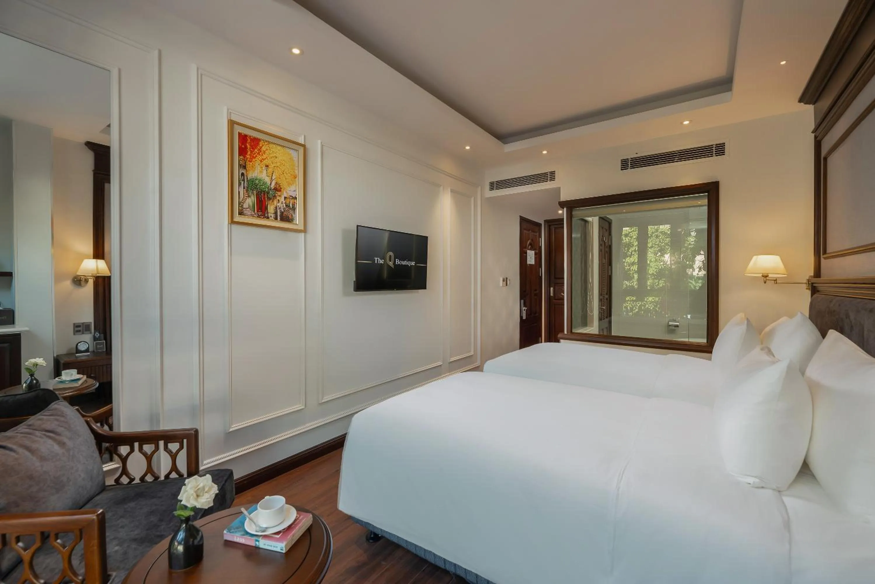 Bed in The Q Boutique Hotel