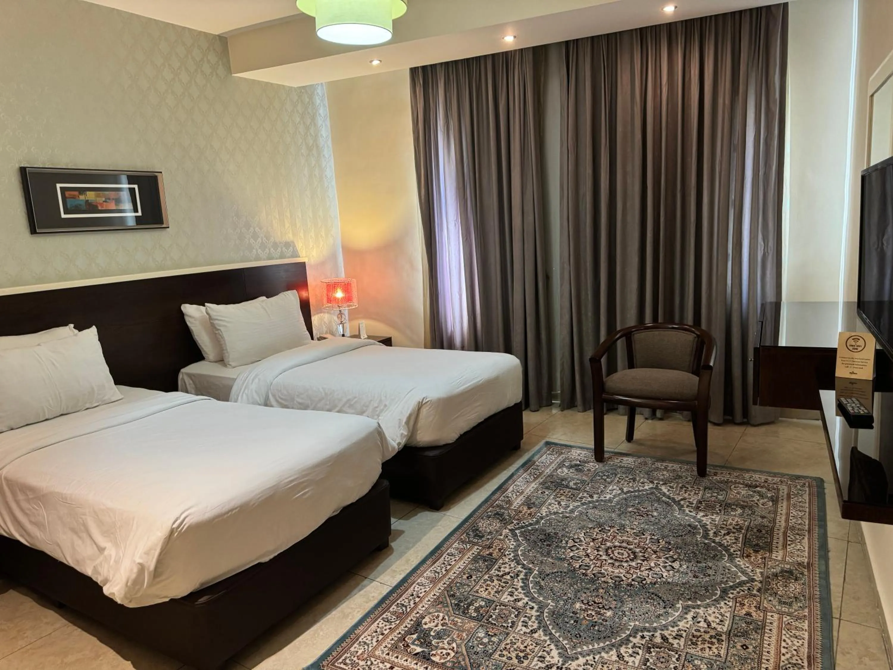 Bed in City Rose Hotel Suites