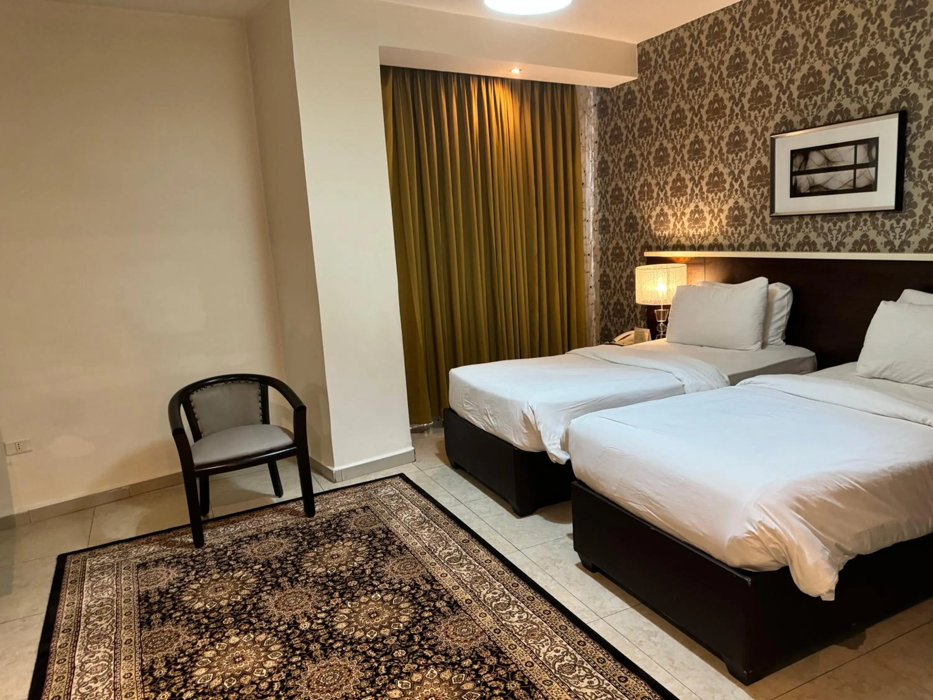 Bed in City Rose Hotel Suites