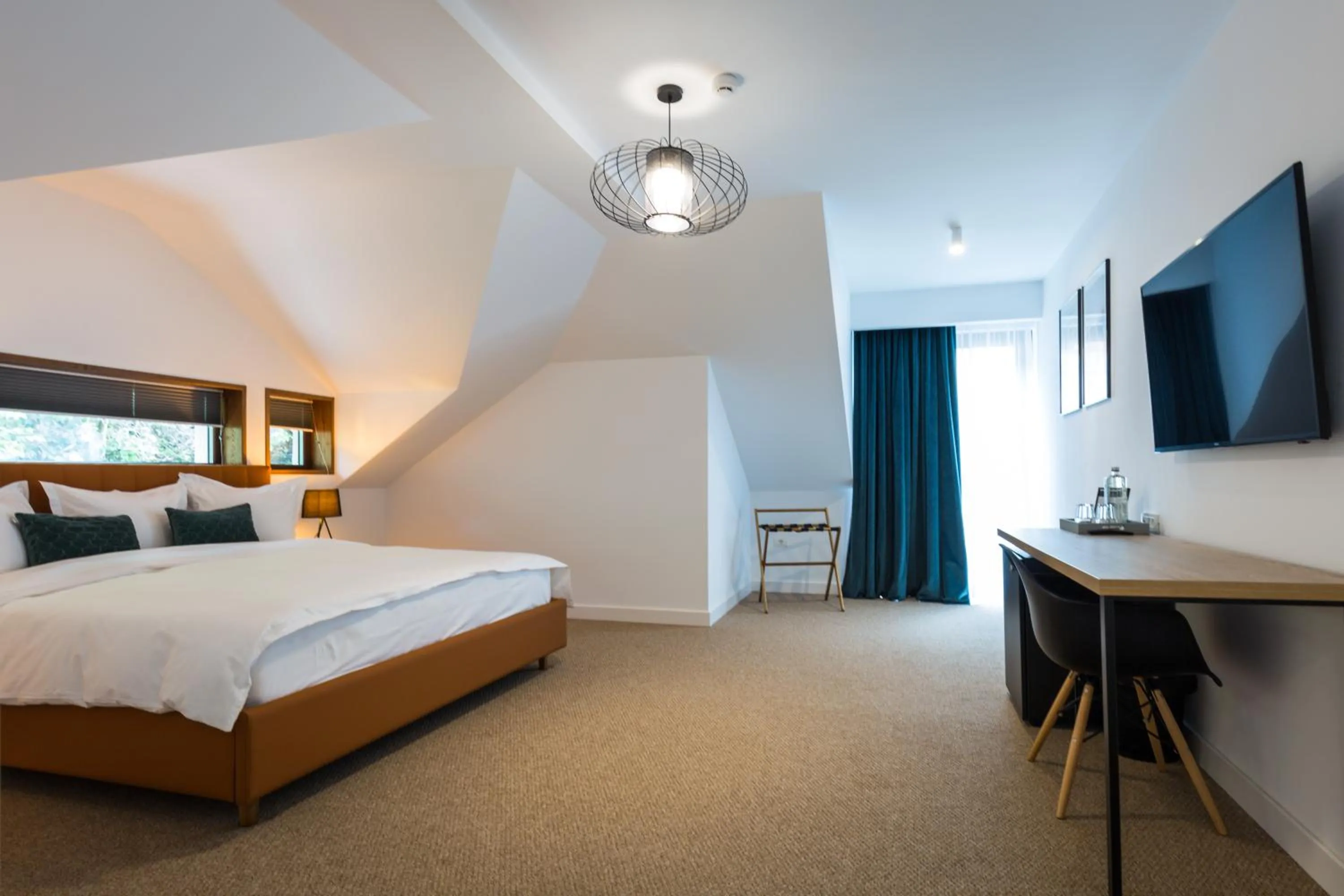 Bed in UpperHouse Suites & More