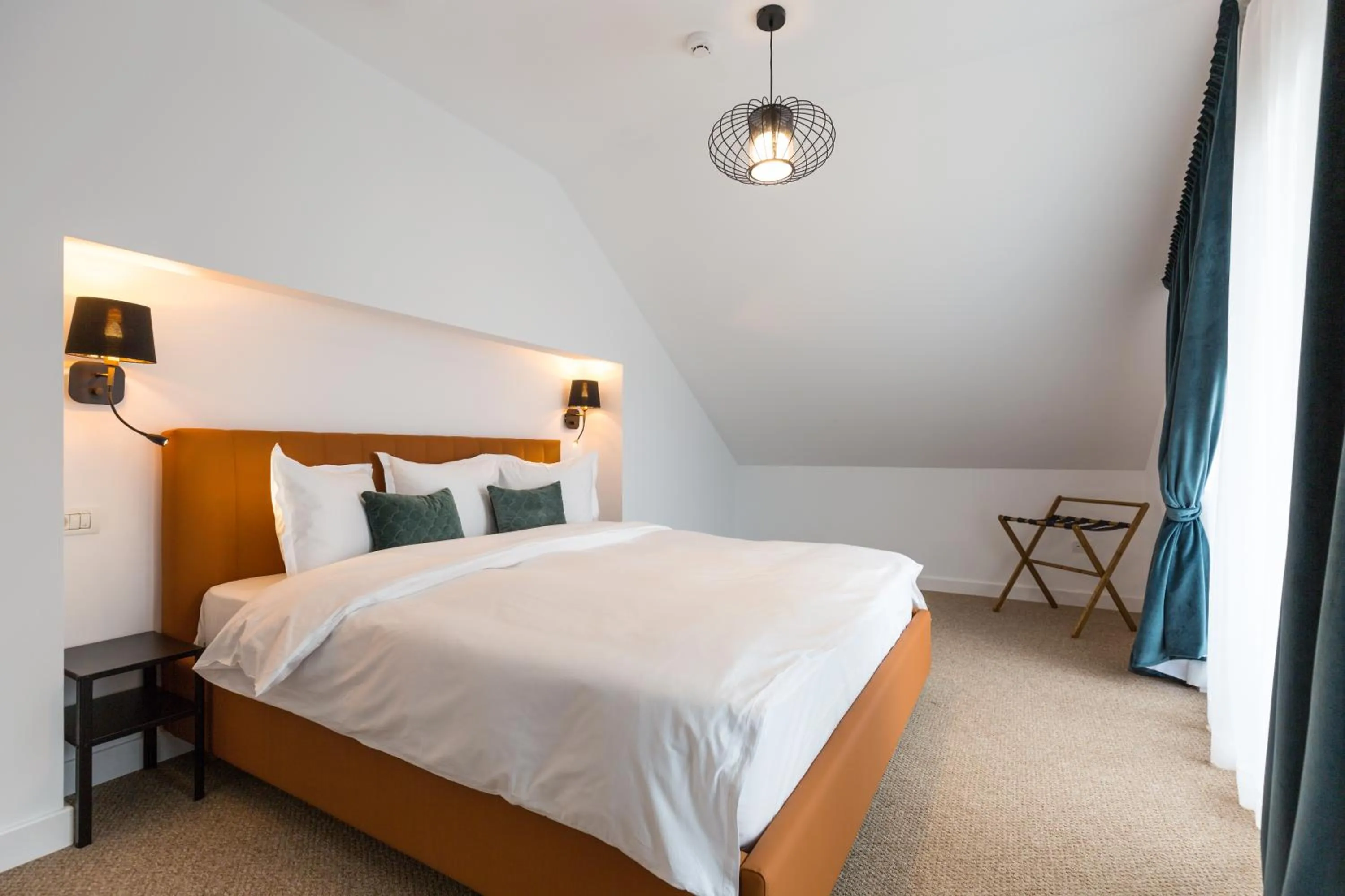 Bed in UpperHouse Suites & More