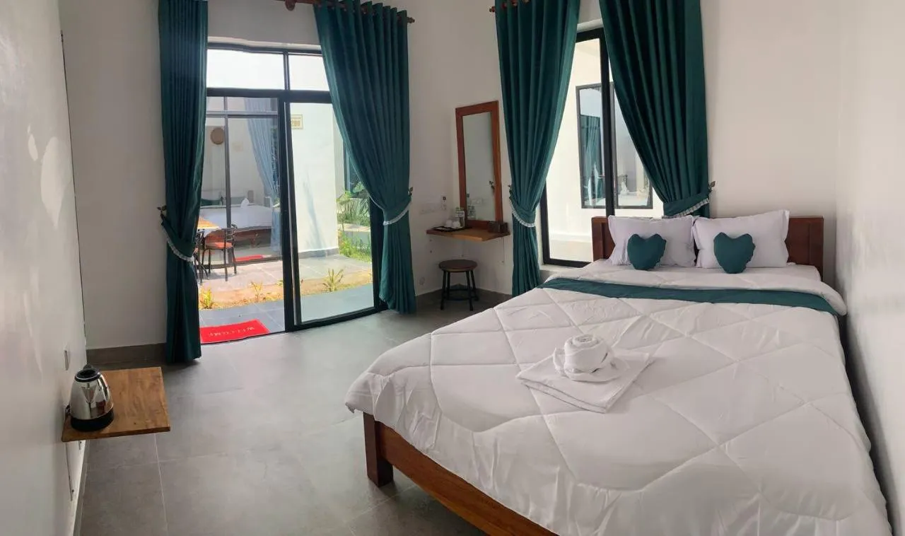 Bed in Kampot River Bungalow by MAMA