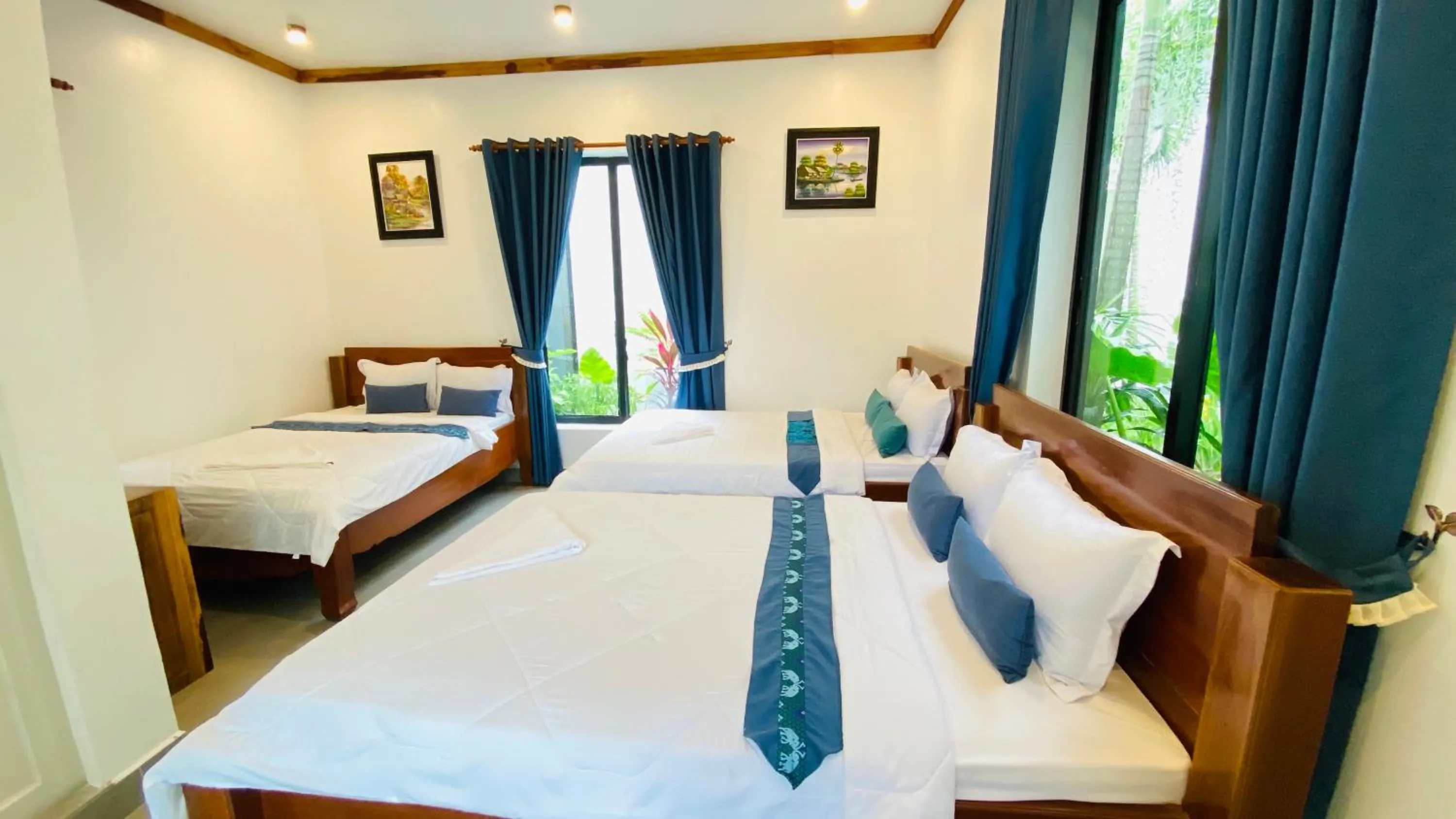 Bed in Kampot River Bungalow by MAMA